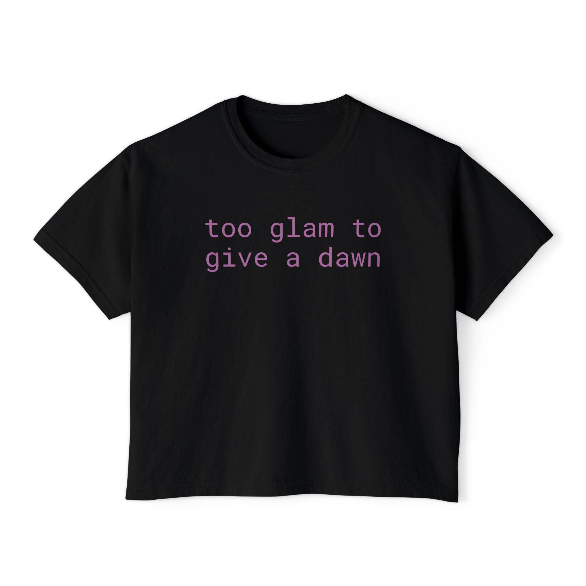 Black eco-friendly women's graphic tee from Printify with purple text reading too glam to give a dawn