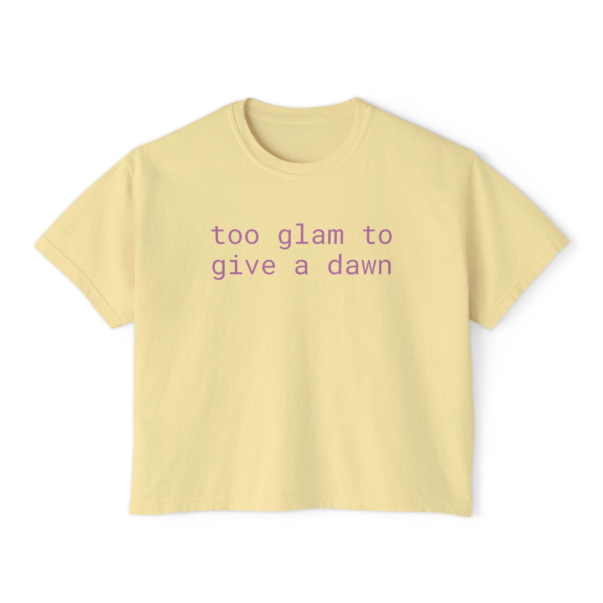 Printify eco-friendly women's graphic tee in light yellow with purple text saying too glam to give a dawn