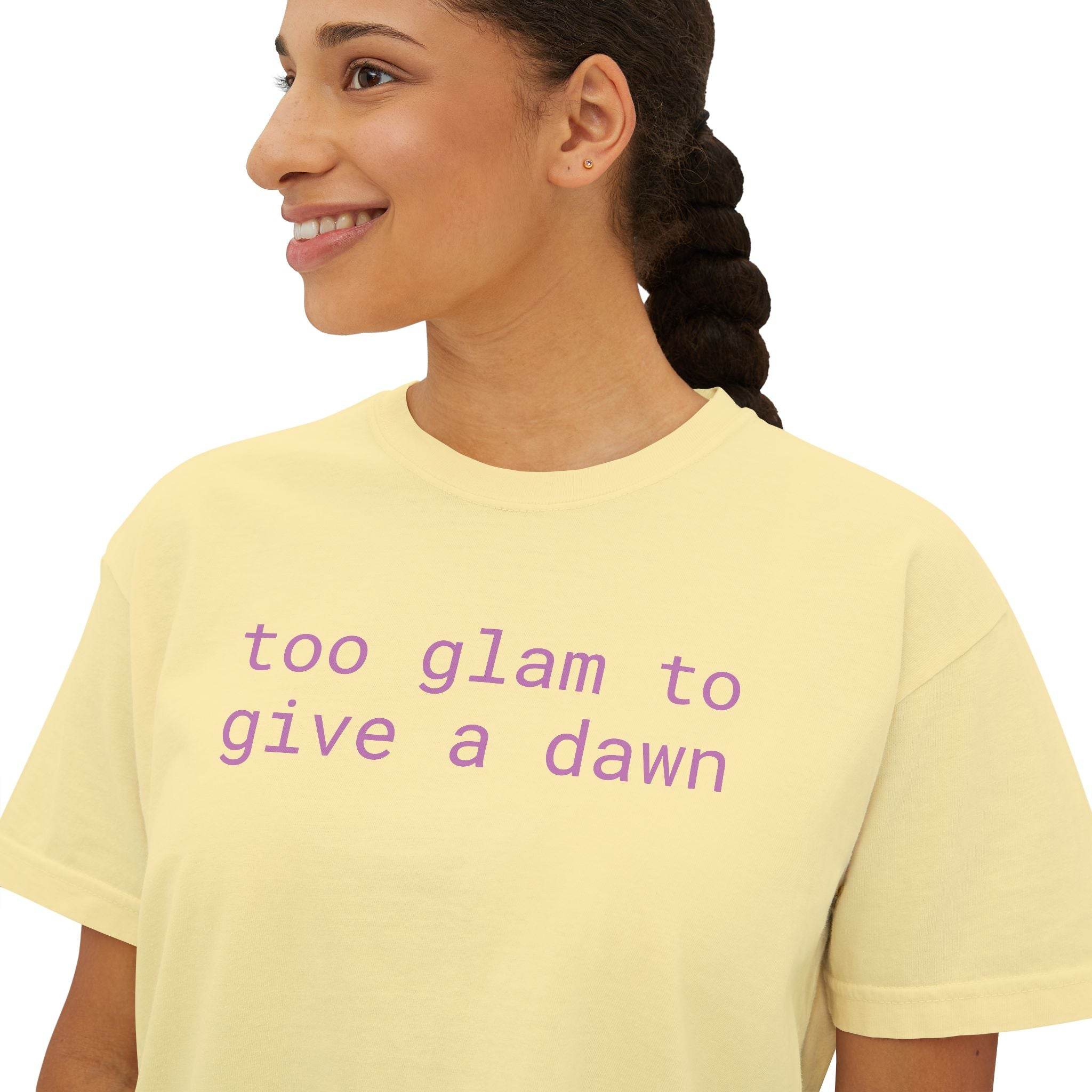 Printify eco-friendly women's graphic tee in light yellow with purple 'too glam to give a dawn' text