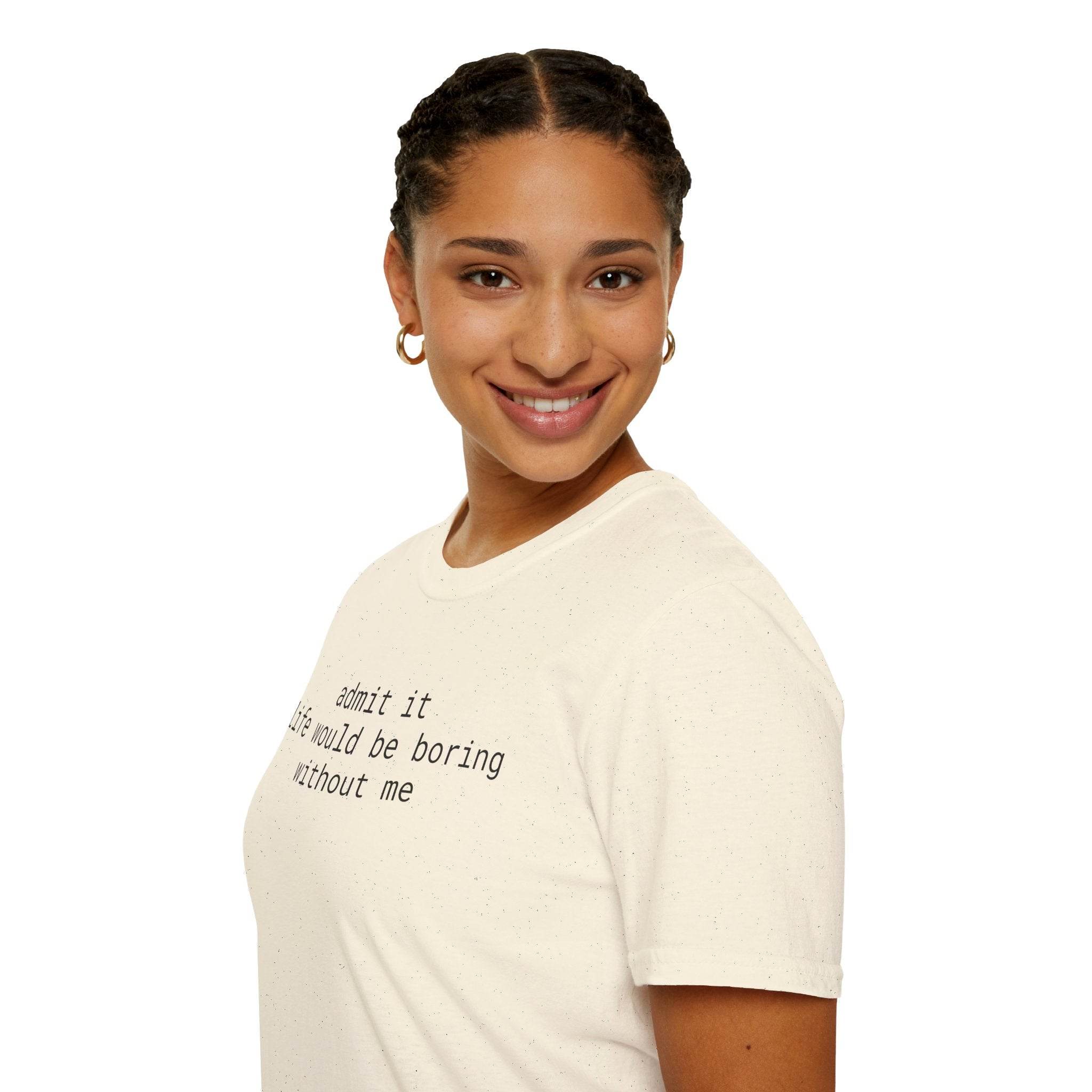 Smiling model wearing Printify cream speckled eco-friendly playful quote t-shirt with black typewriter text