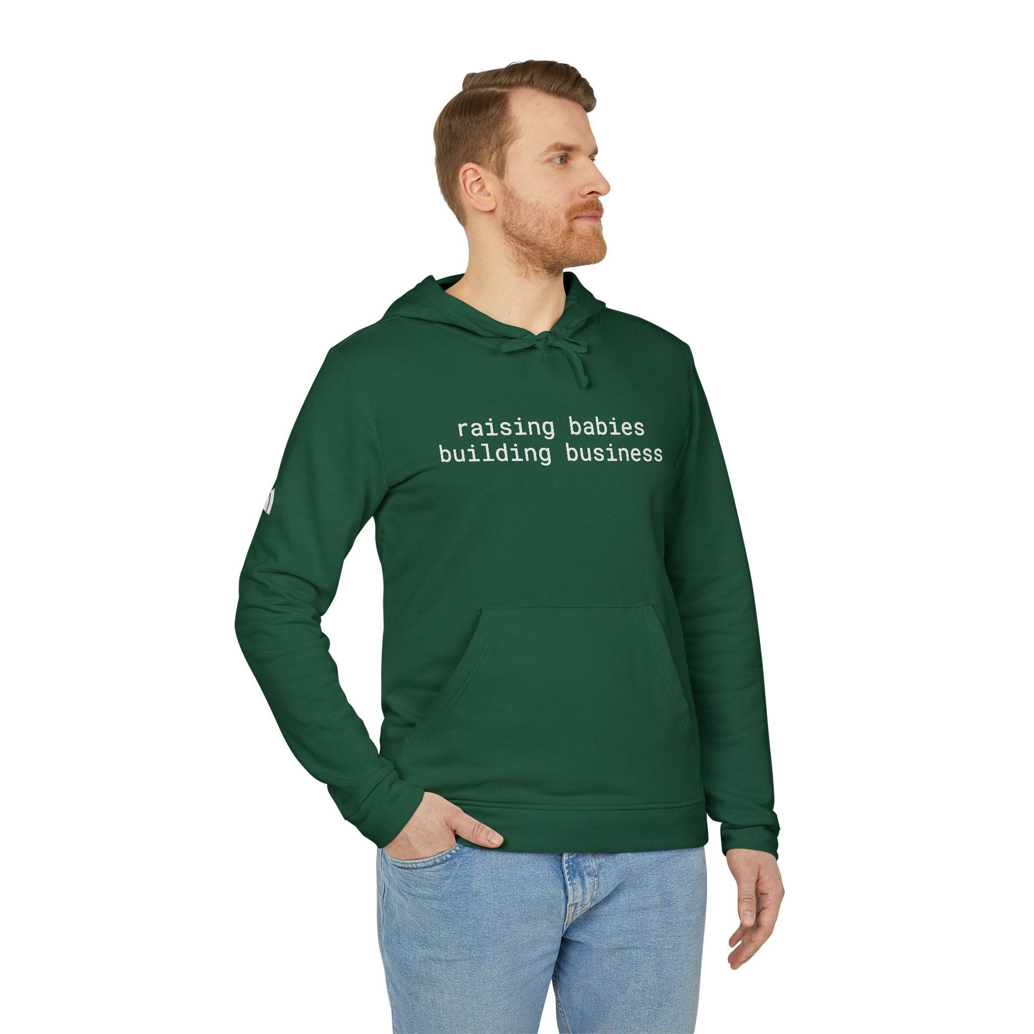 Printify eco-friendly unisex fleece hoodie dark green with white text raising babies building business on male model