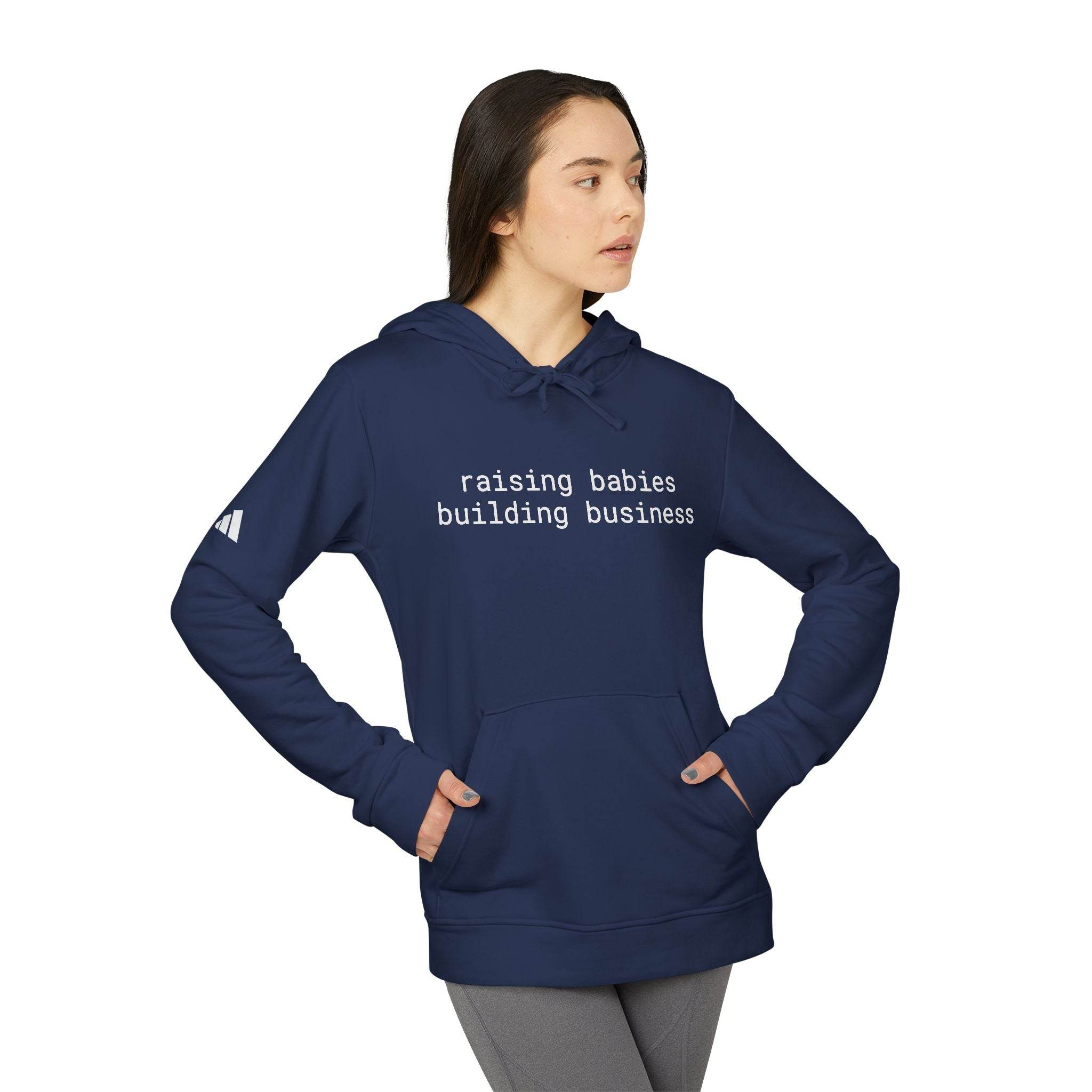 Printify navy eco-friendly unisex fleece hoodie with kangaroo pocket and text raising babies building business