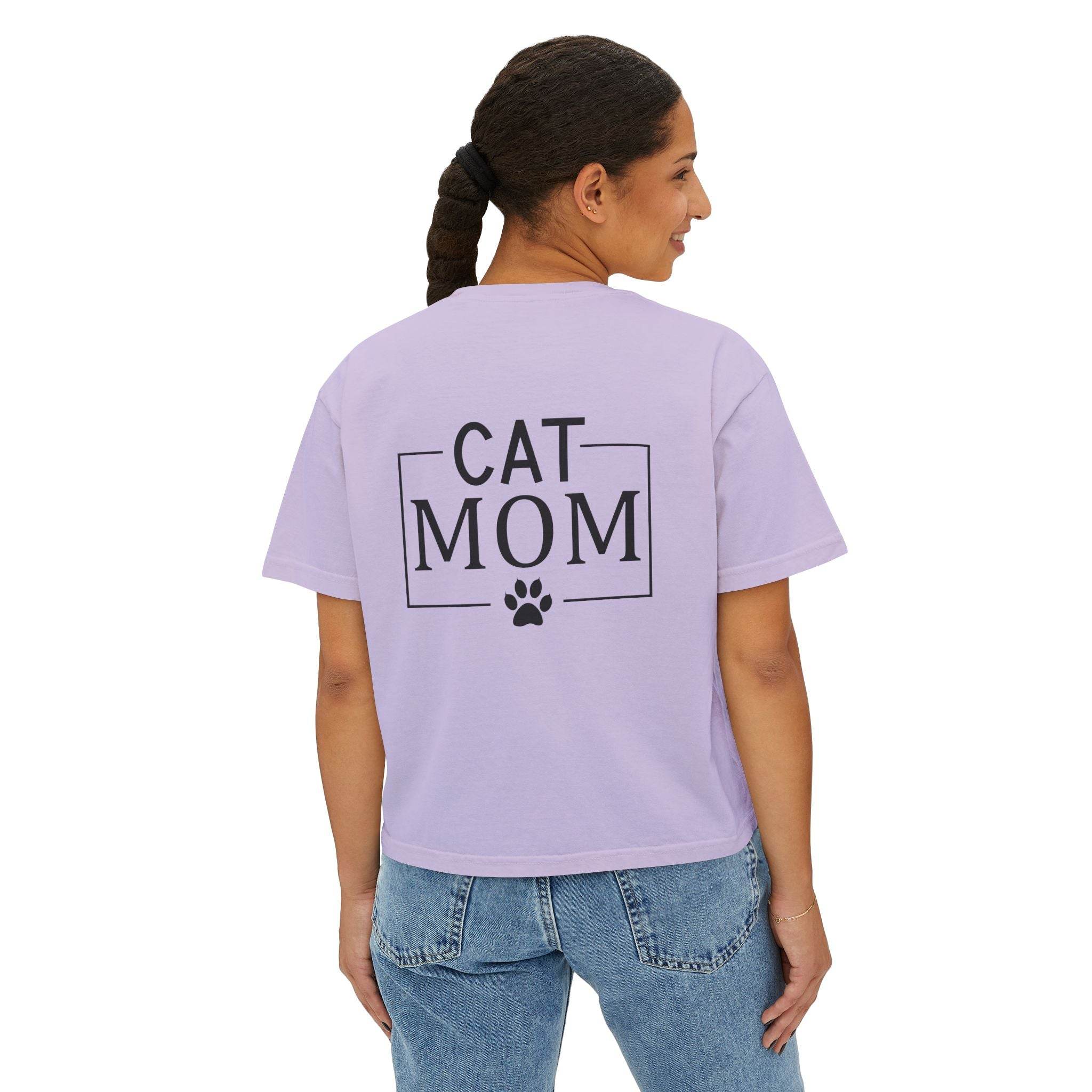 Woman wearing lavender cropped eco-friendly cat mom shirt with black CAT MOM text and paw print on back