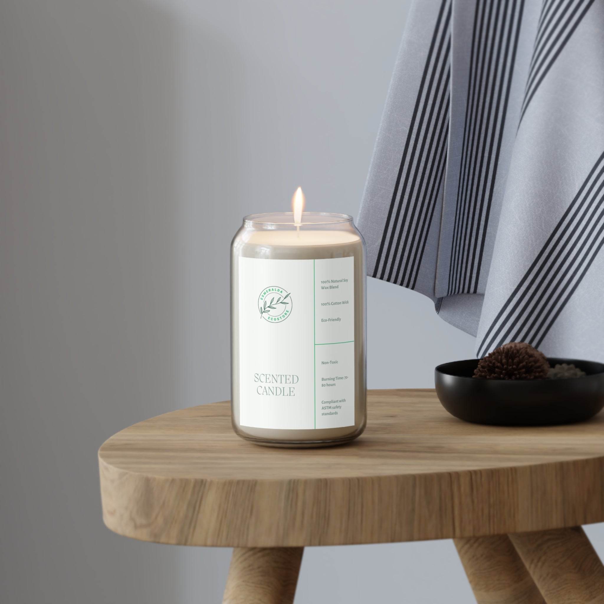 Printify eco-friendly scented candle lit on wooden table next to striped fabric and decorative bowl