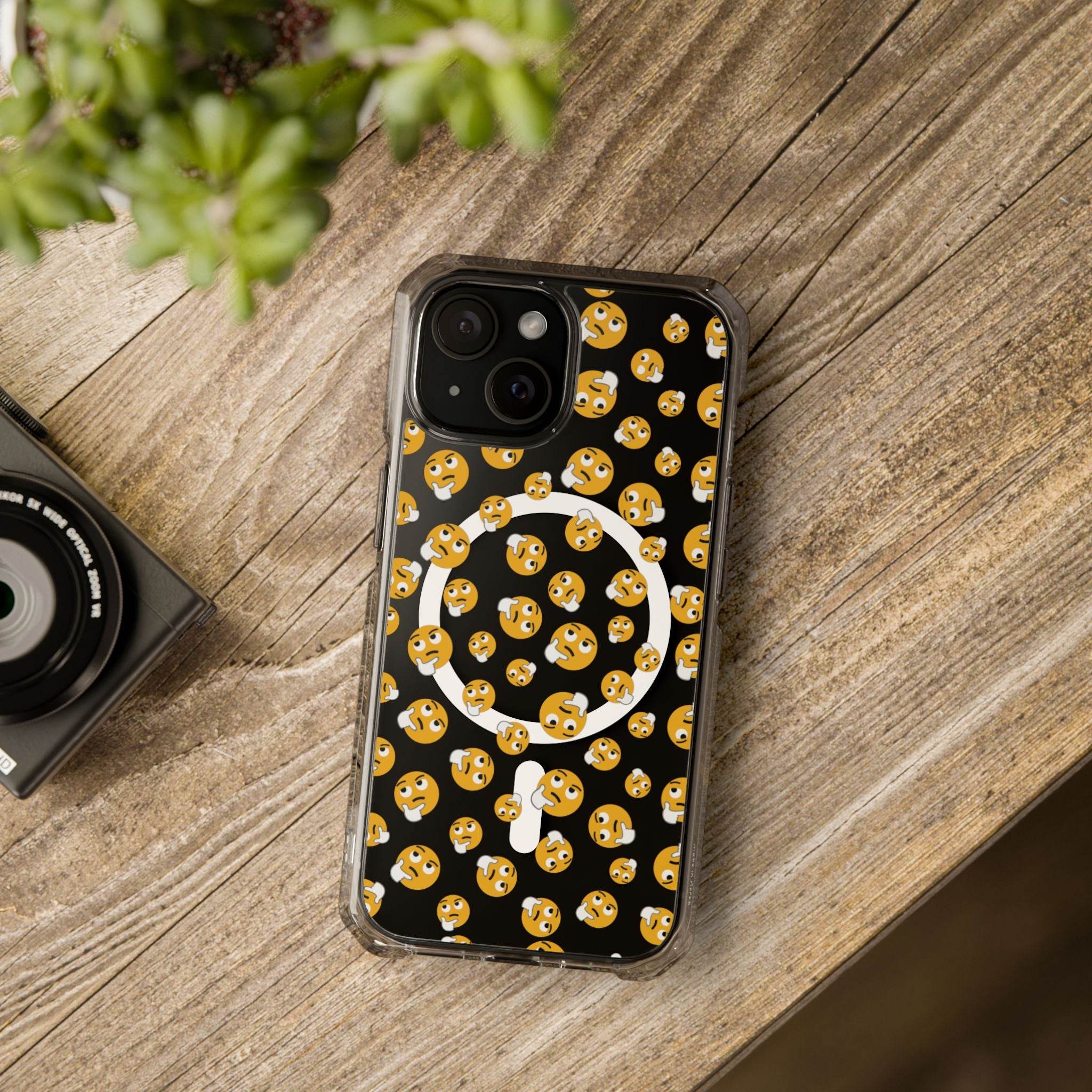 Printify eco-friendly magnetic phone case with black background and smiling emoji pattern on wooden surface