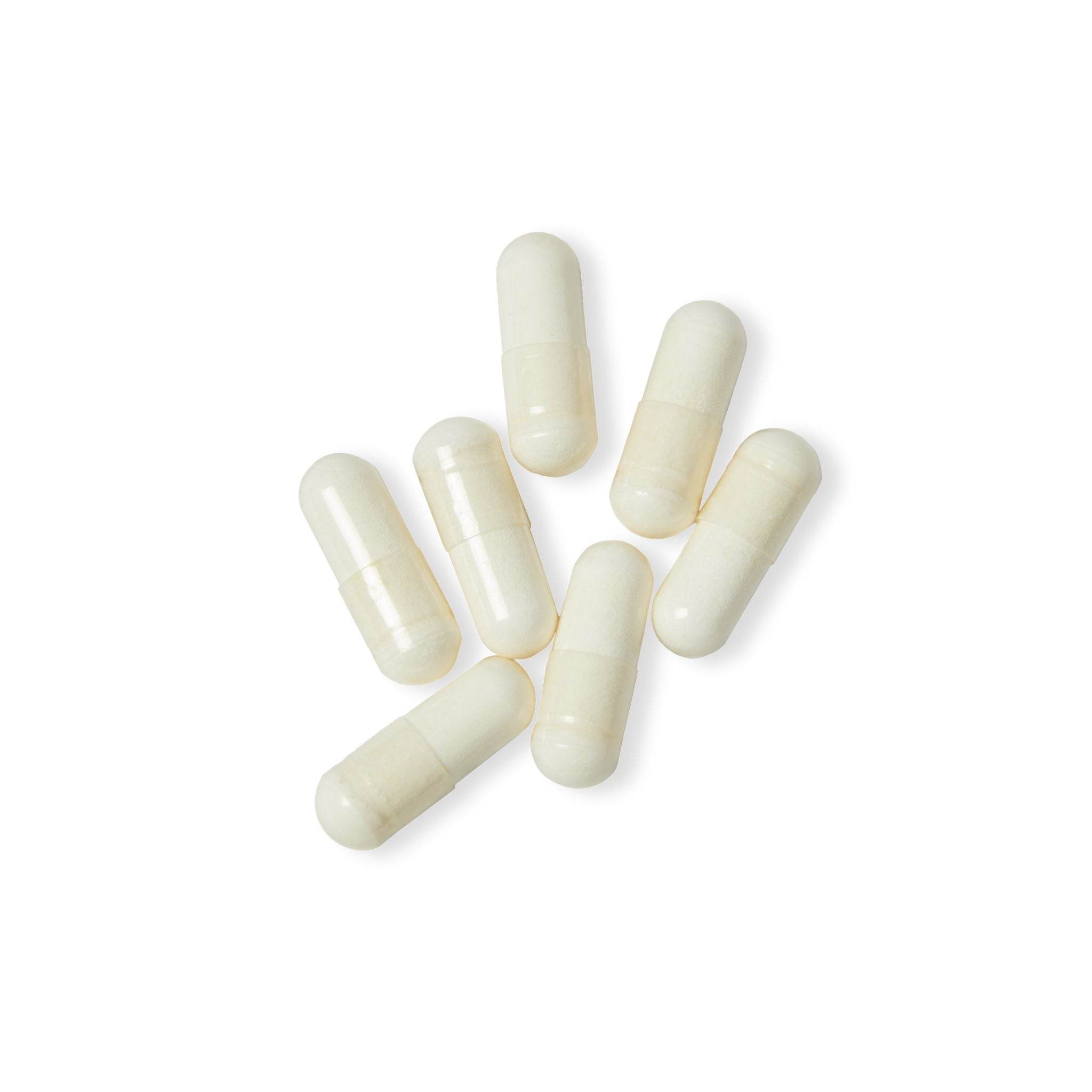 White non-GMO L-arginine capsules supplement pills isolated on white background