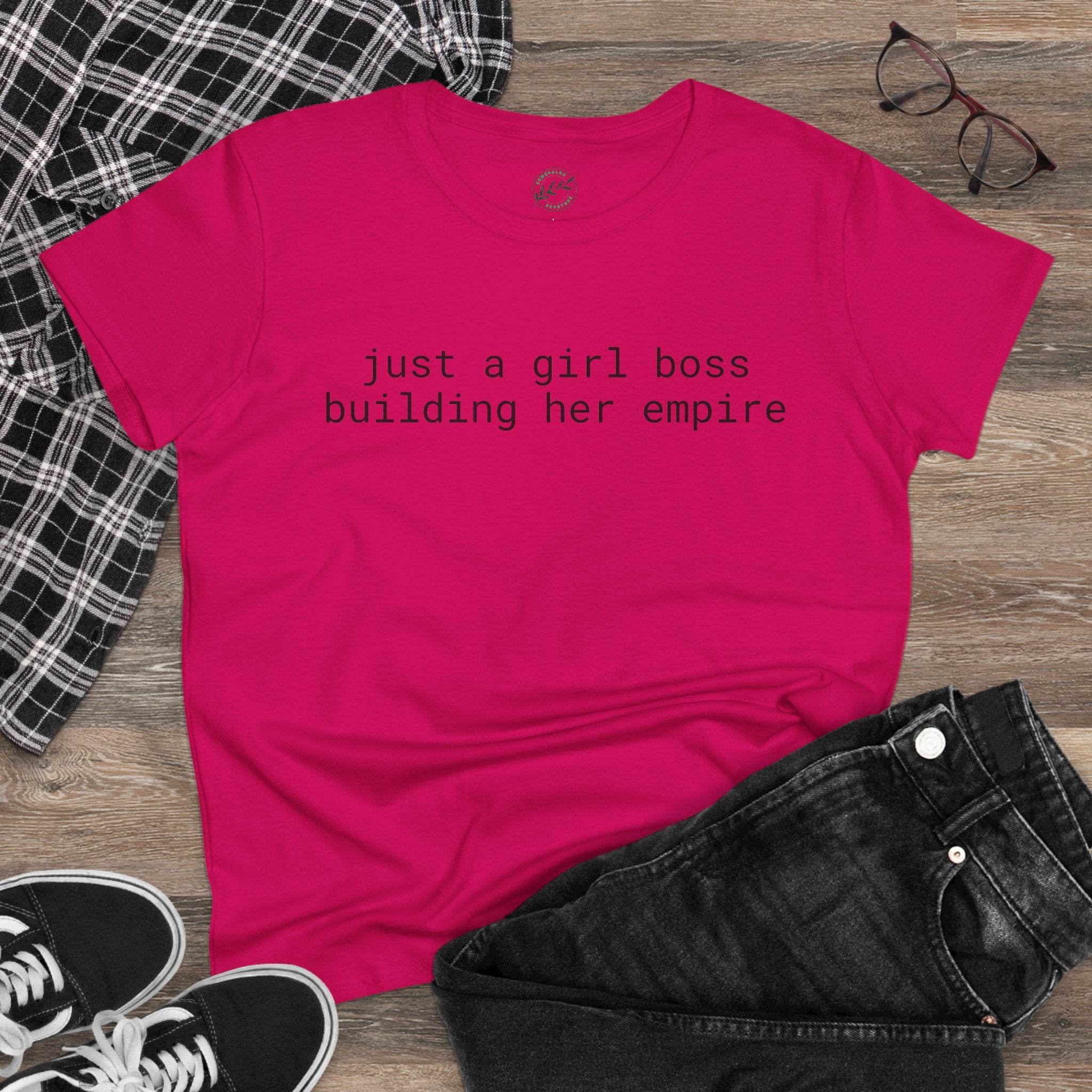 eco-friendly girl boss shirt hot pink tee with text just a girl boss building her empire flatlay with jeans