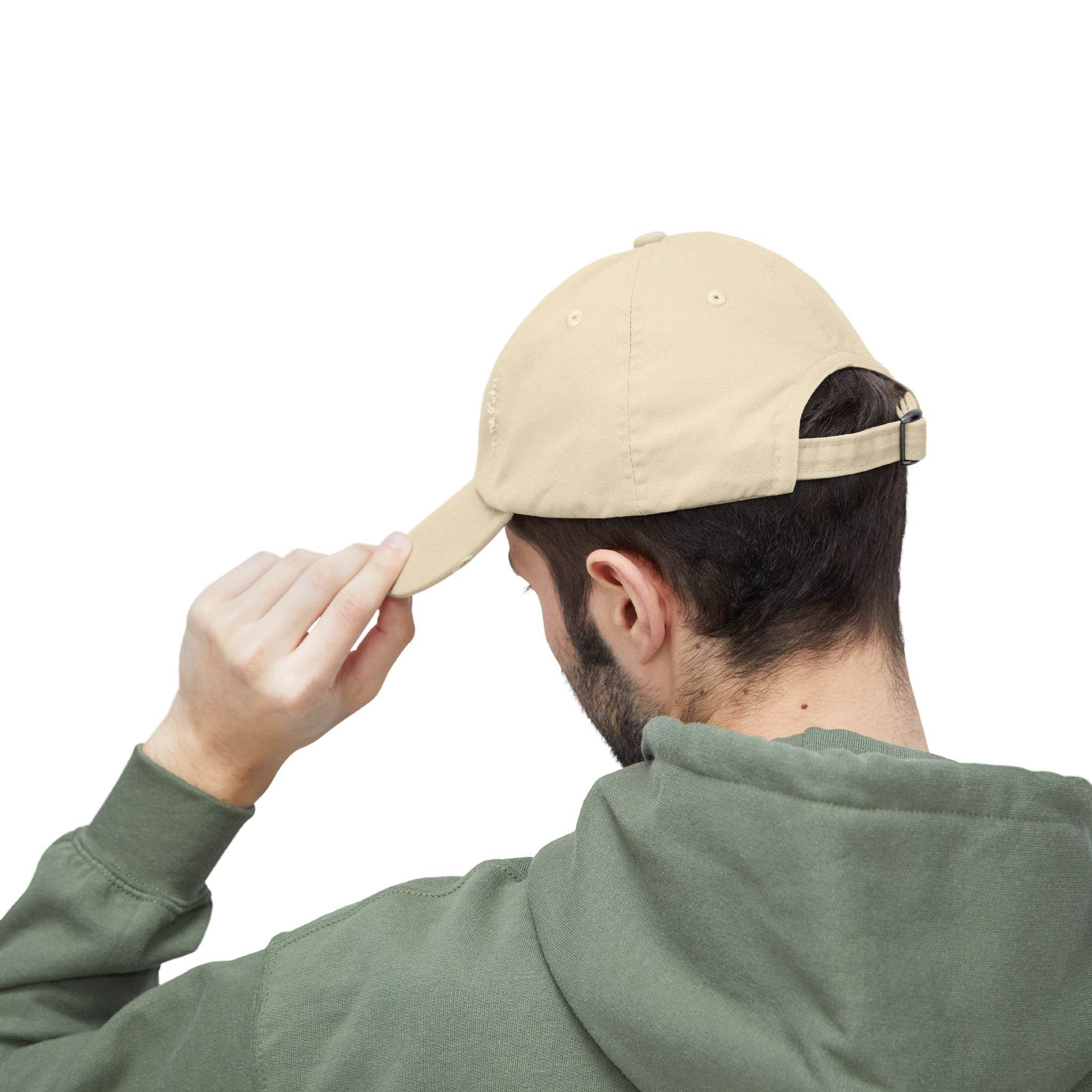 Beige adjustable baseball cap modeled by man in green hoodie showing rear strap eco-friendly pet lover hat