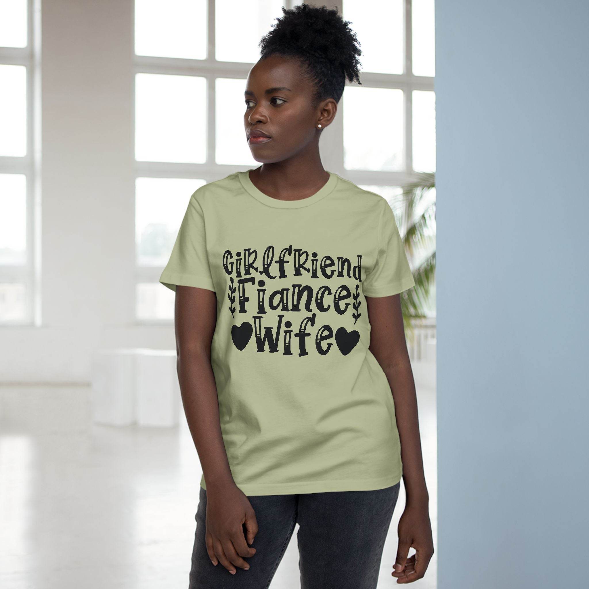 Model wearing eco-friendly women's relationship tee in sage green with black Girlfriend Fiance Wife typography