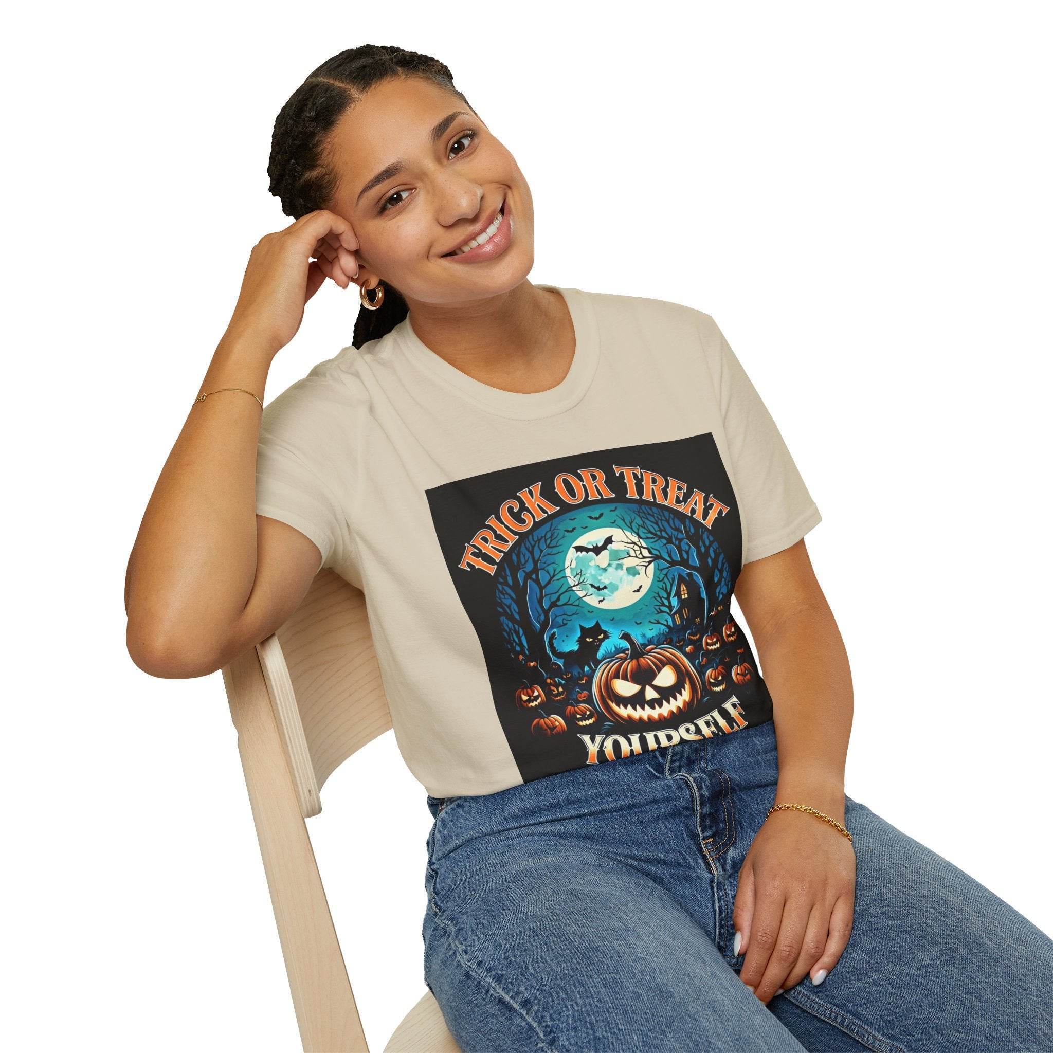 Printify model wearing eco-friendly Halloween t-shirt with moonlit jack o lantern, bats and pumpkins on cream tee