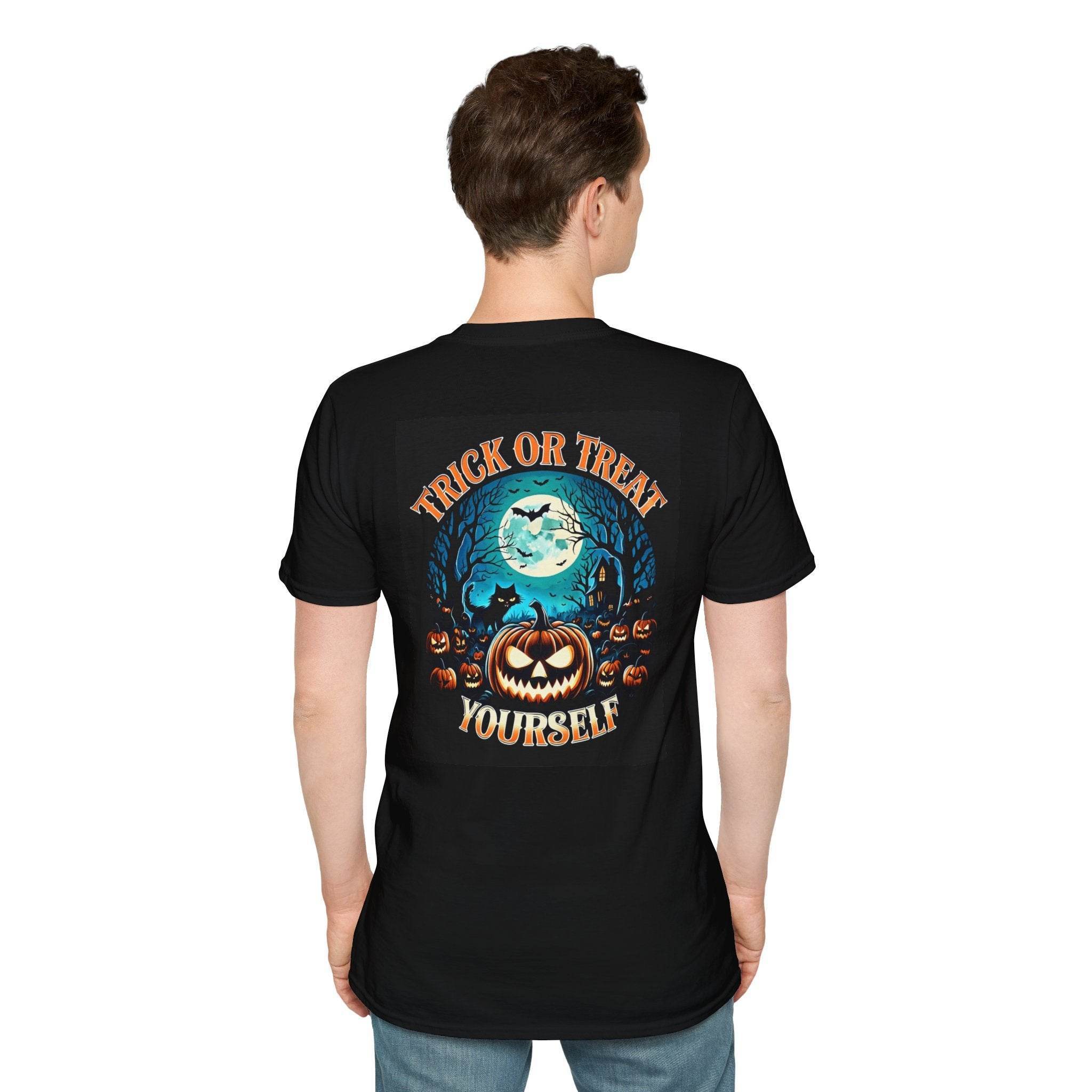 Back view of man wearing black eco-friendly Halloween t-shirt with jack o lantern moon bats and Trick or Treat Yourself text