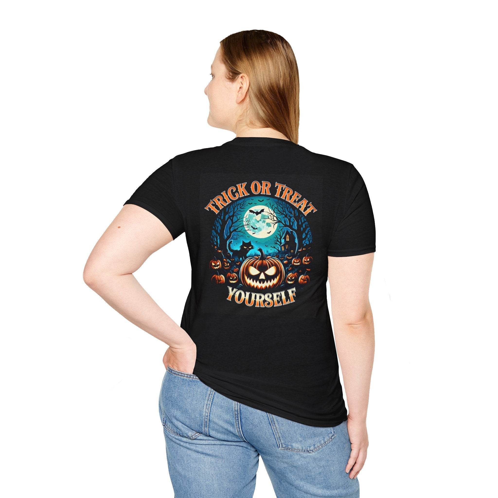 Woman wearing black eco-friendly Halloween t-shirt with Trick or Treat Yourself pumpkin design and moonlit graveyard