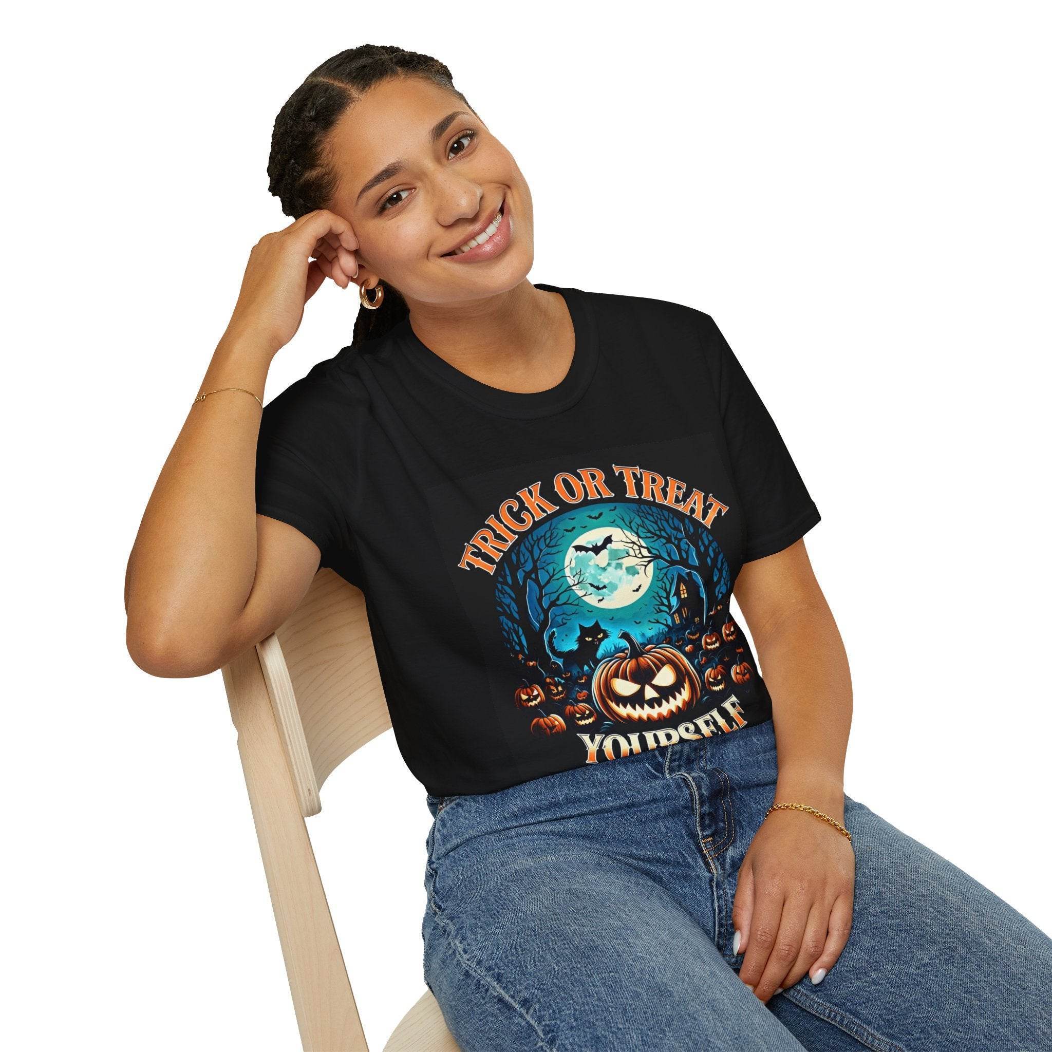 Printify eco-friendly Halloween t-shirt on smiling woman wearing black tee with jack o lantern moon and bats design