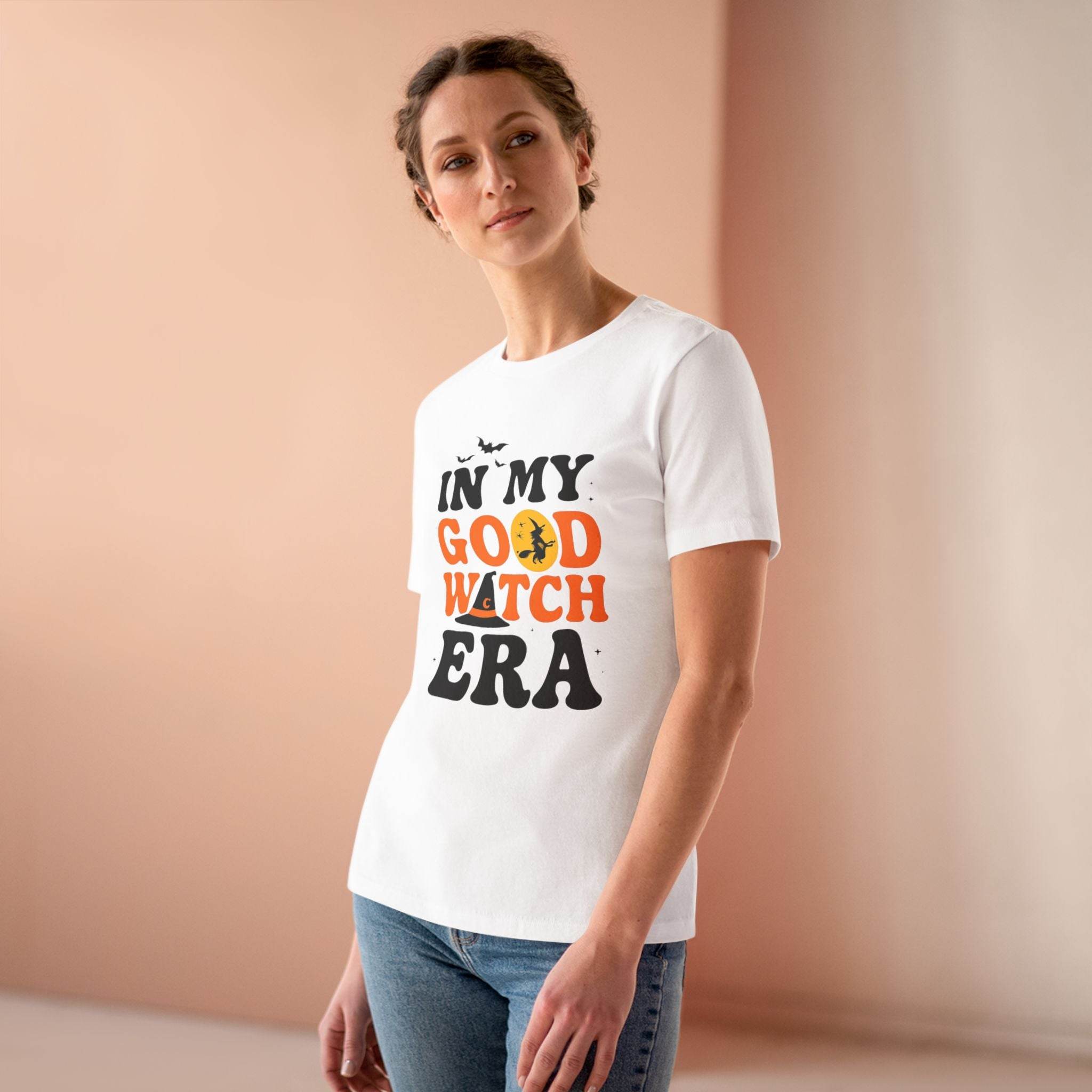 eco friendly halloween t shirt women white tee on model with In My Good Witch Era pumpkin and bat design