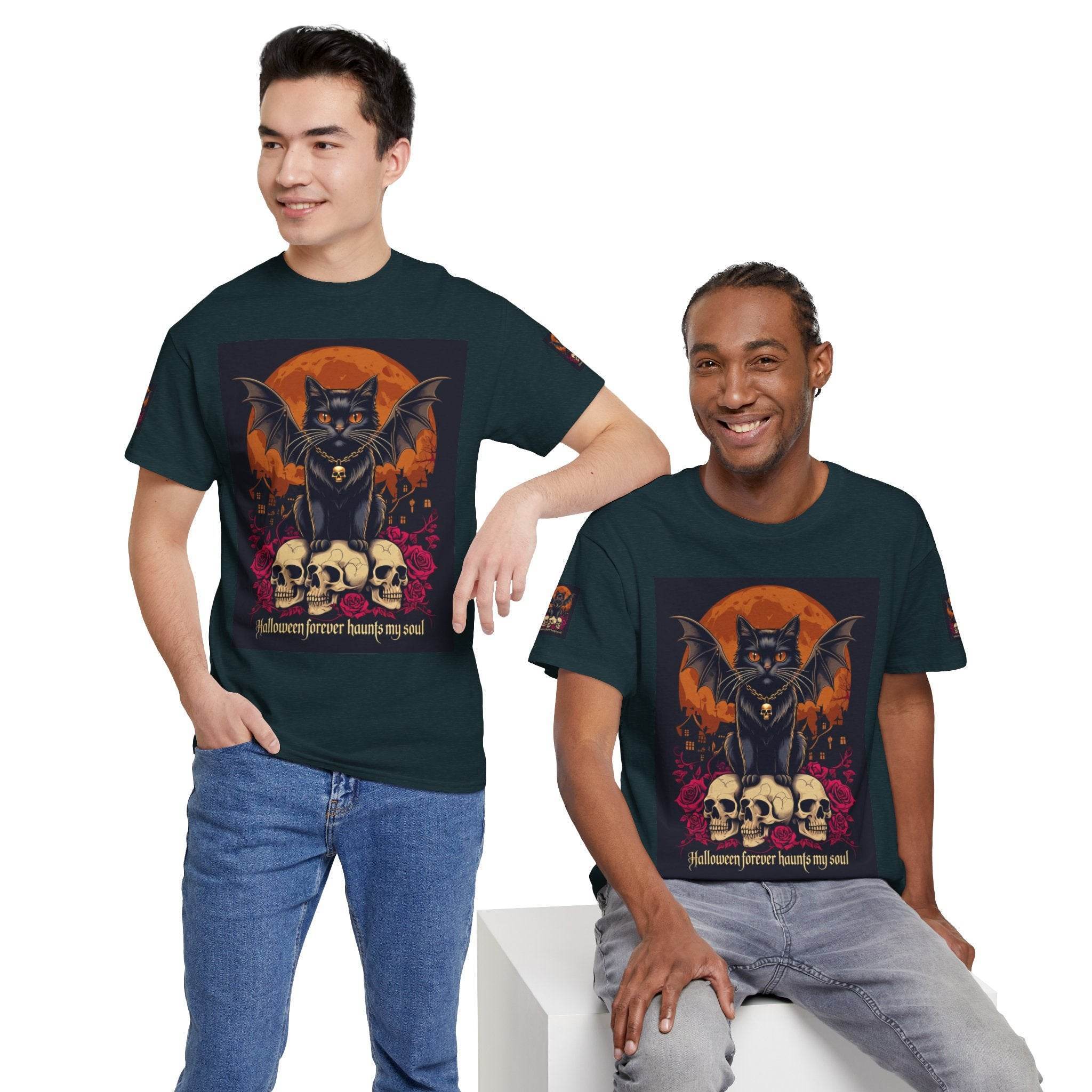 eco-friendly Halloween cat shirt worn by two men in dark green tees featuring a bat wing black cat on skulls and orange moon