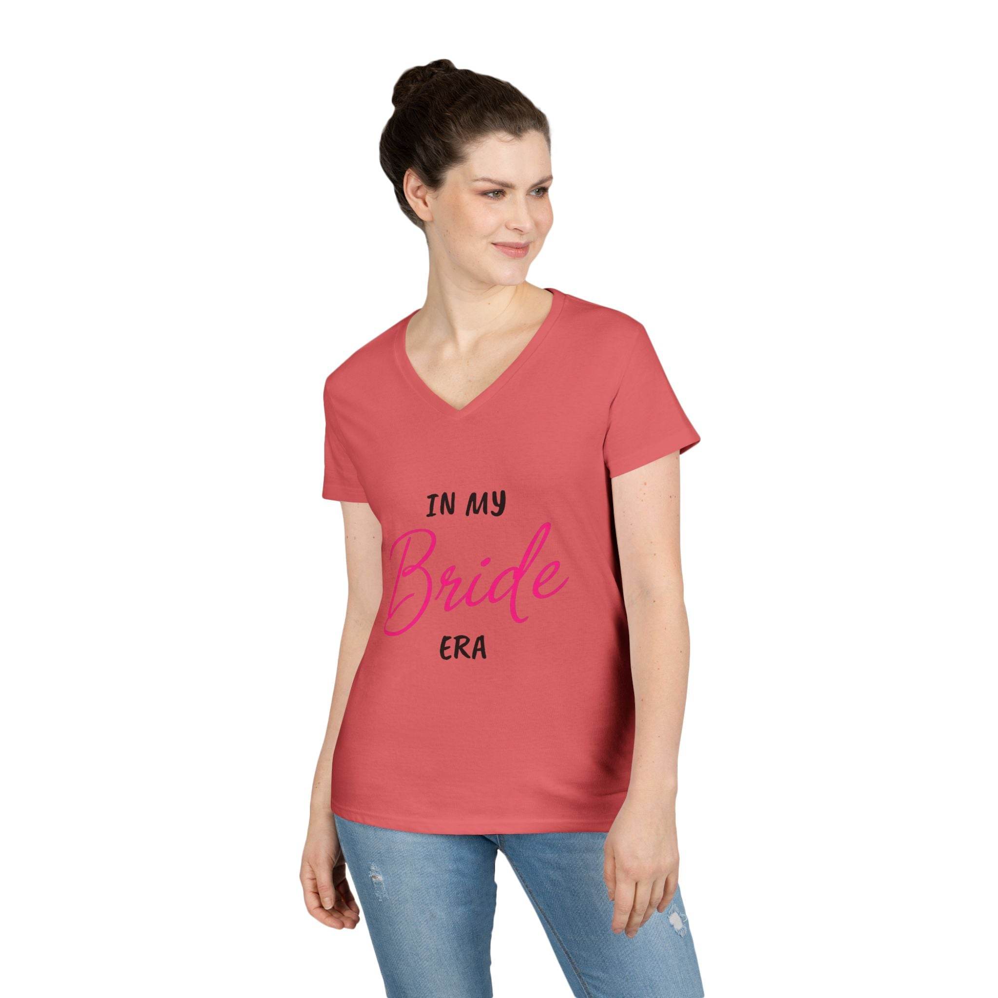 Printify coral V neck womens t shirt with In My Bride Era script worn by model with jeans eco-friendly bride t-shirt