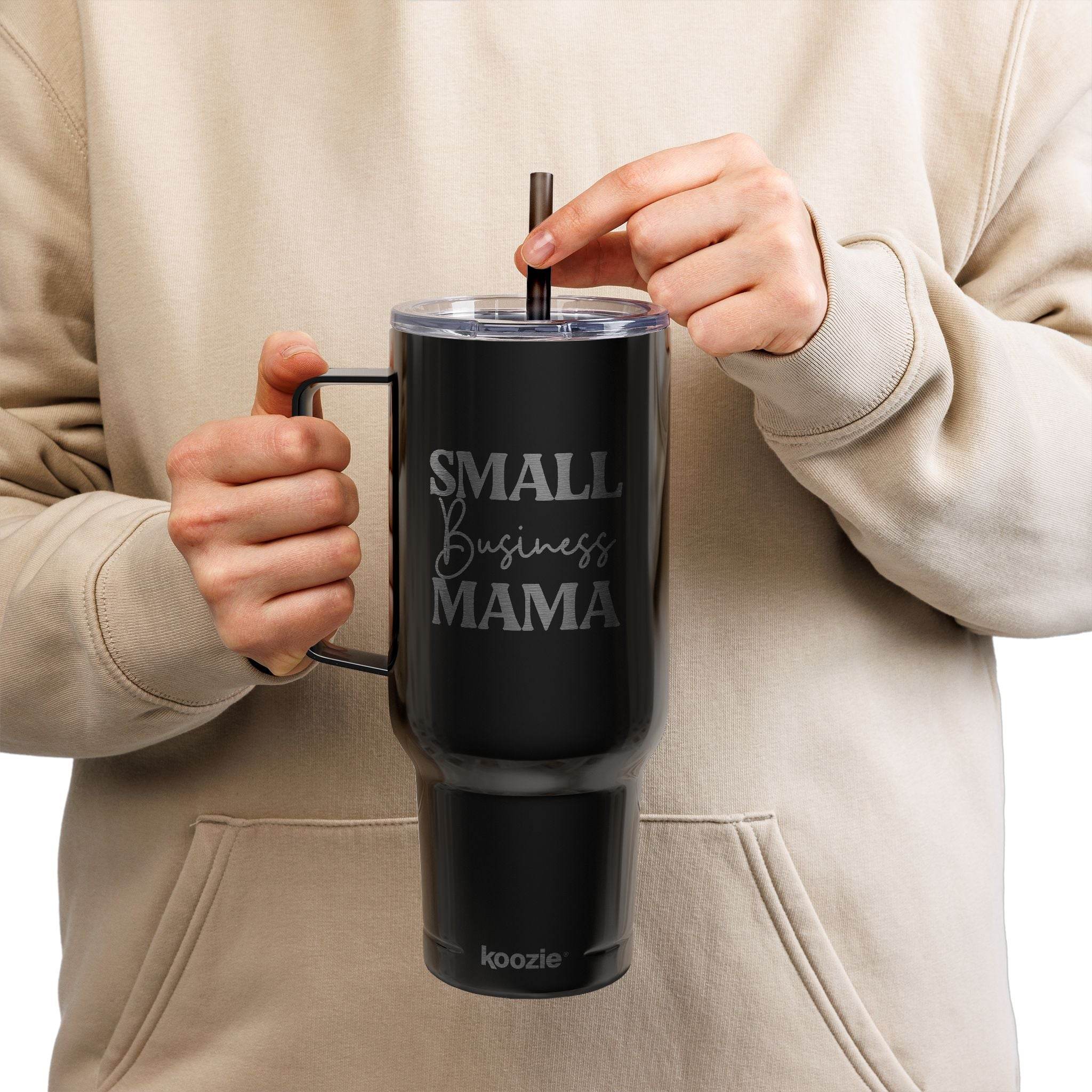 Printify black eco-friendly insulated tumbler with handle and straw held by person wearing beige hoodie