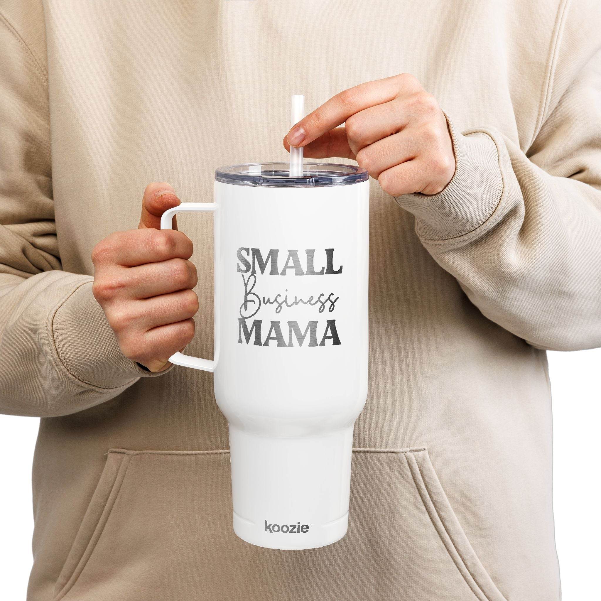 White eco-friendly insulated tumbler with handle and straw featuring Small Business Mama text held by person