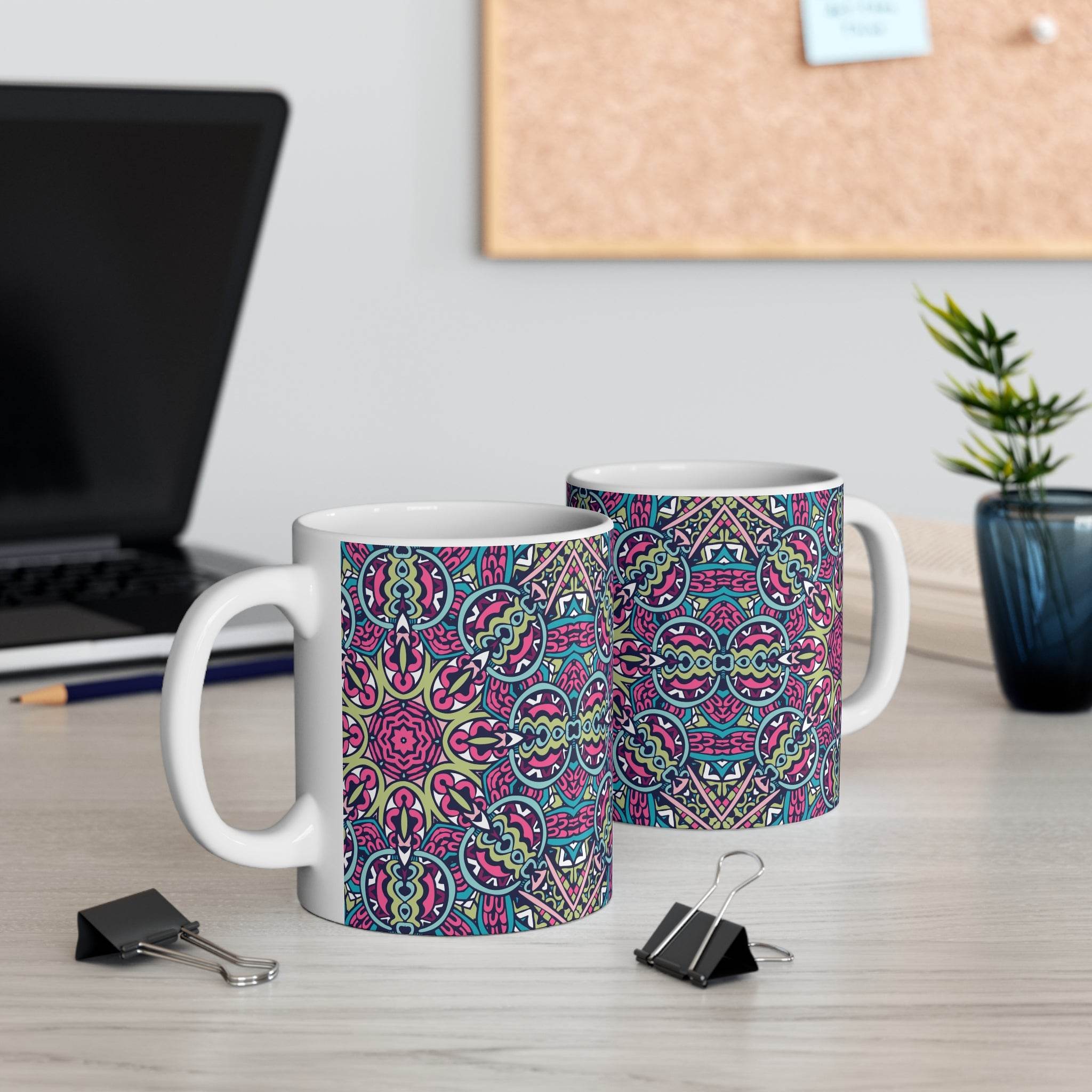 Printify mandala design eco mug with colorful intricate pattern on white ceramic mug on desk
