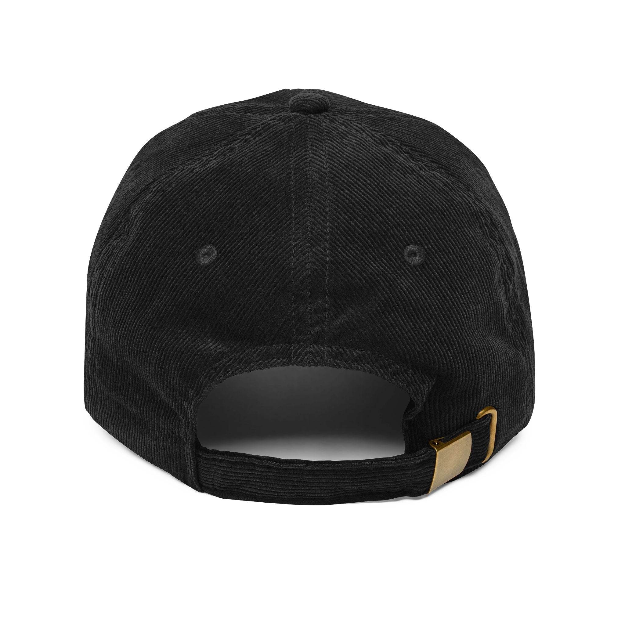 Back view of black vintage corduroy cap with adjustable strap and brass buckle by Printify