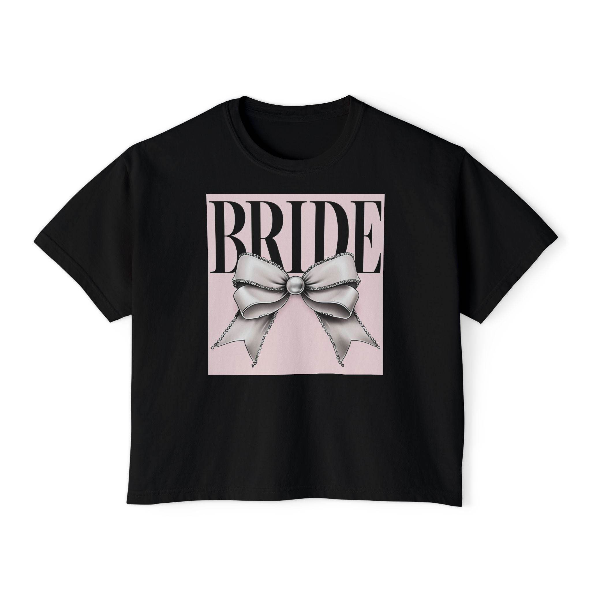 Printify black cropped tee with pink square and silver bow graphic reading BRIDE eco-friendly bridal t-shirt