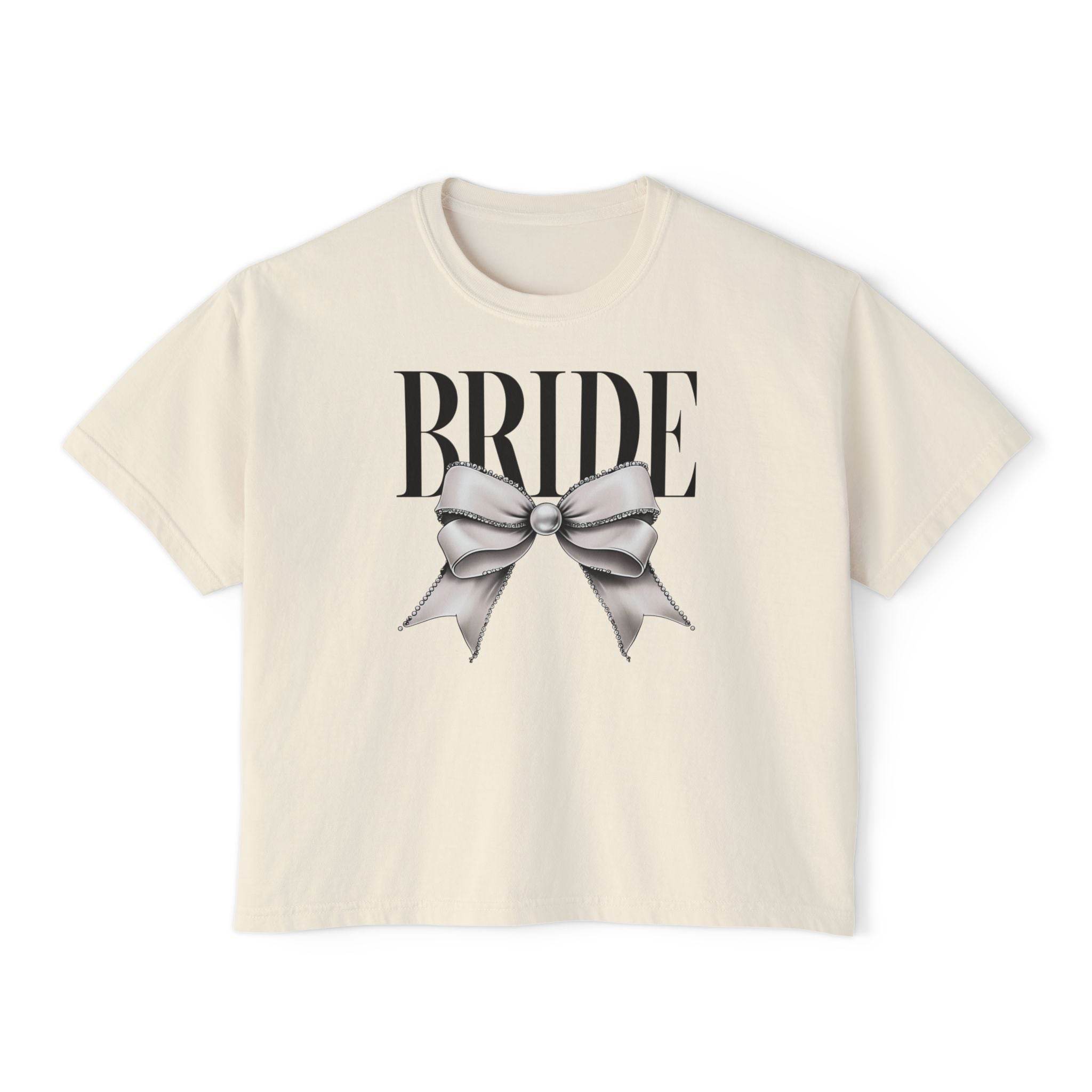 Printify cream cropped crewneck eco-friendly bridal t-shirt with large BRIDE text and gray satin bow print
