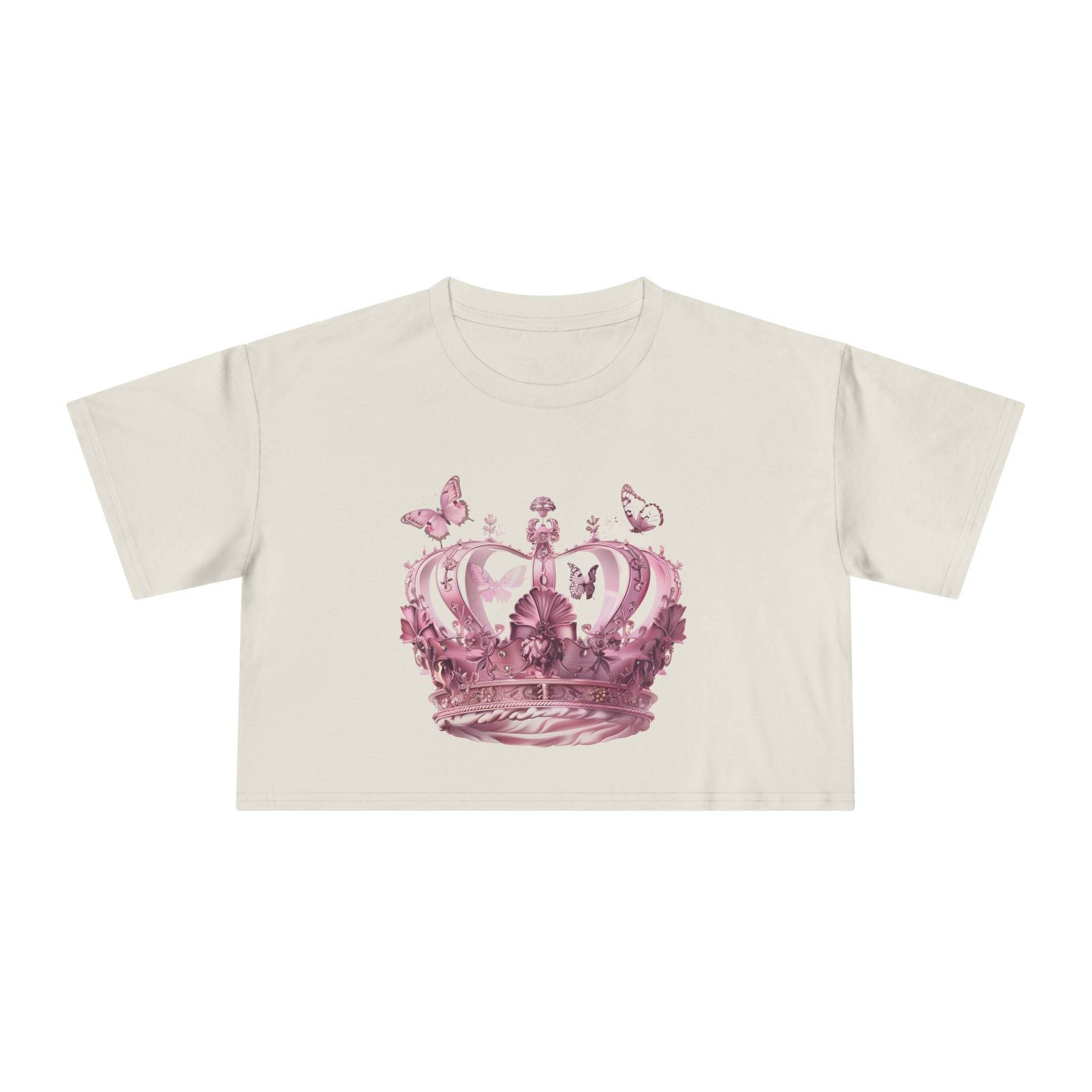 Petal & Crown eco crop shirt by Printify featuring a pink crown and butterflies design on a light beige crop t-shirt