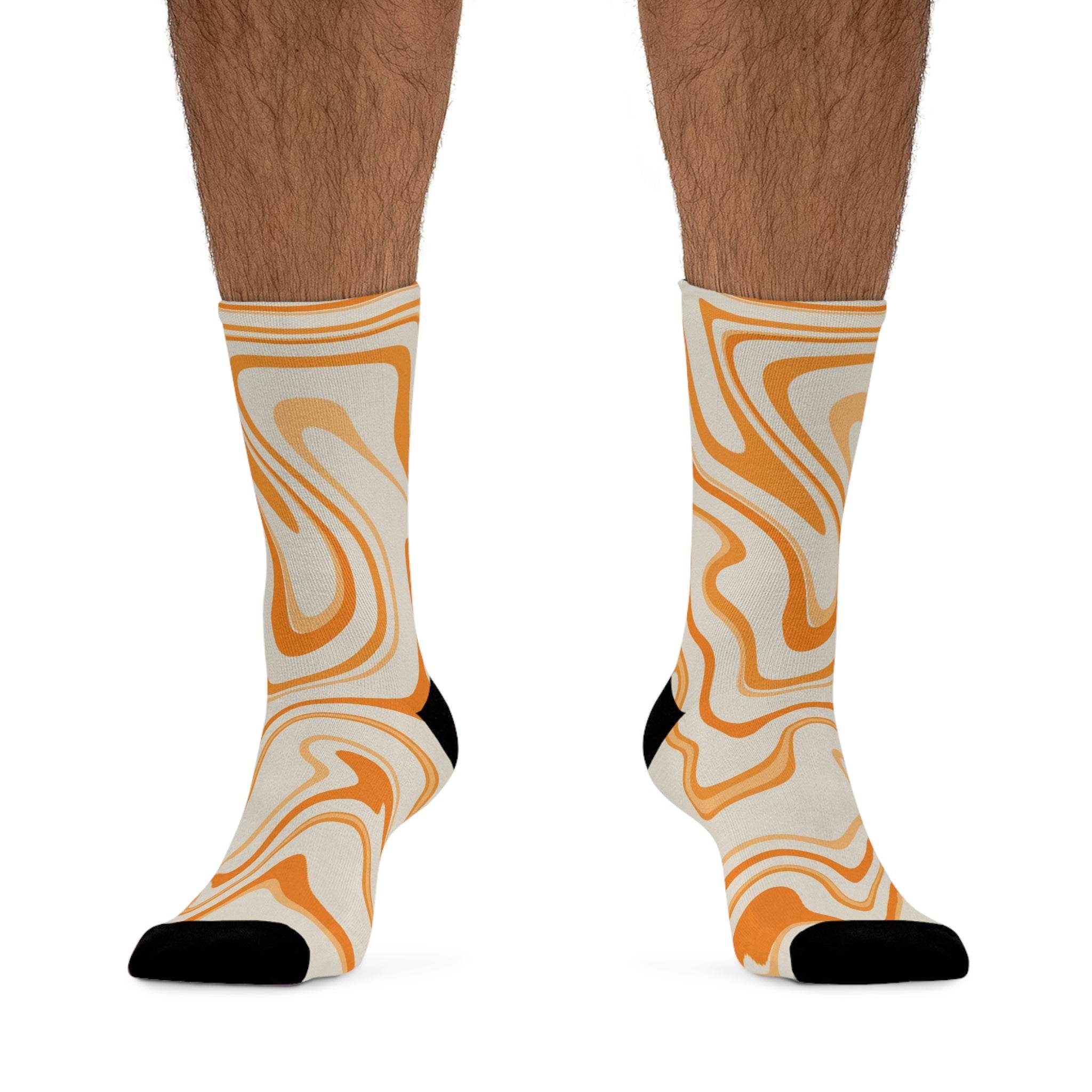 Printify recycled poly socks with orange and beige abstract swirl design and black toe and heel
