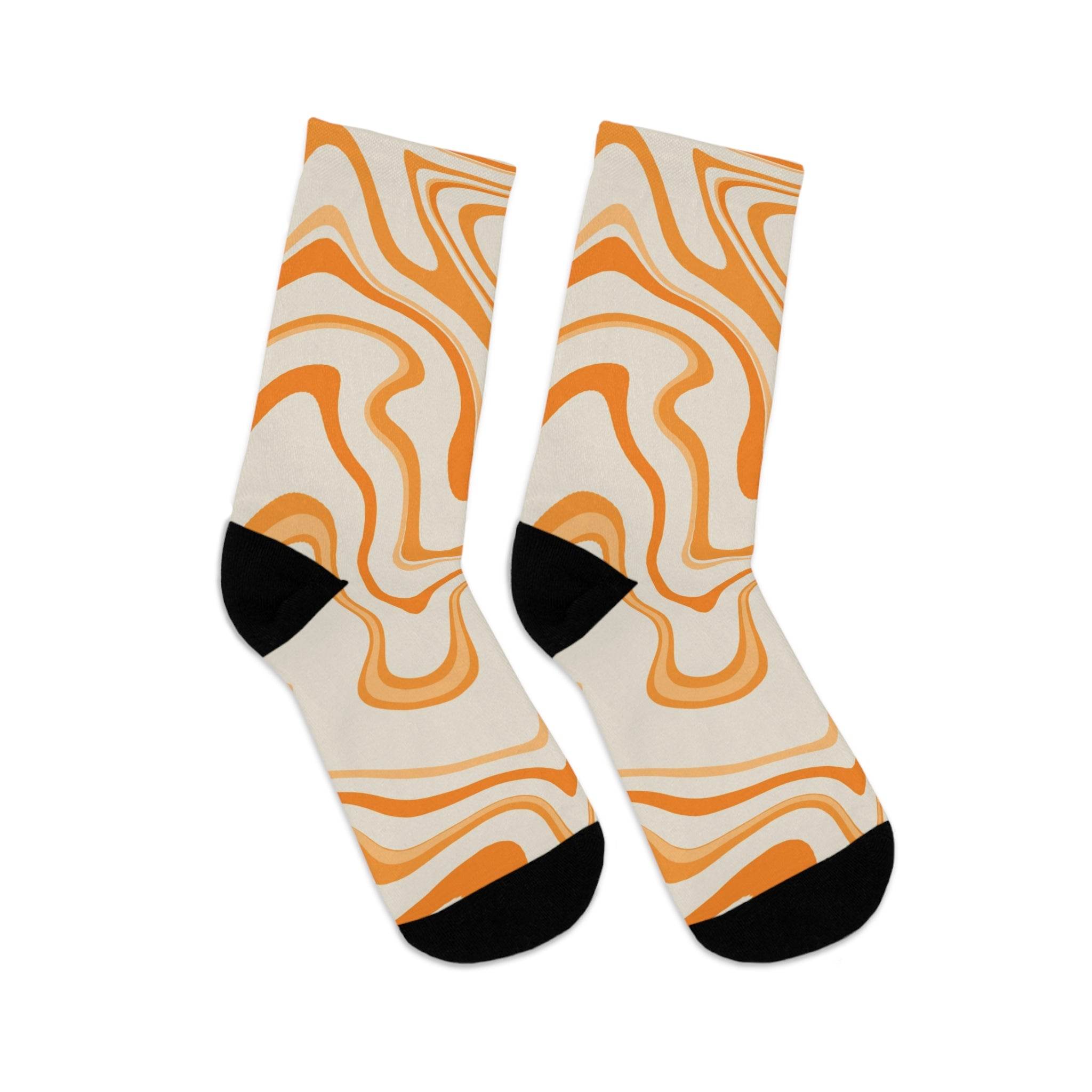 Printify recycled poly socks with orange and beige swirl pattern and black toe and heel accents