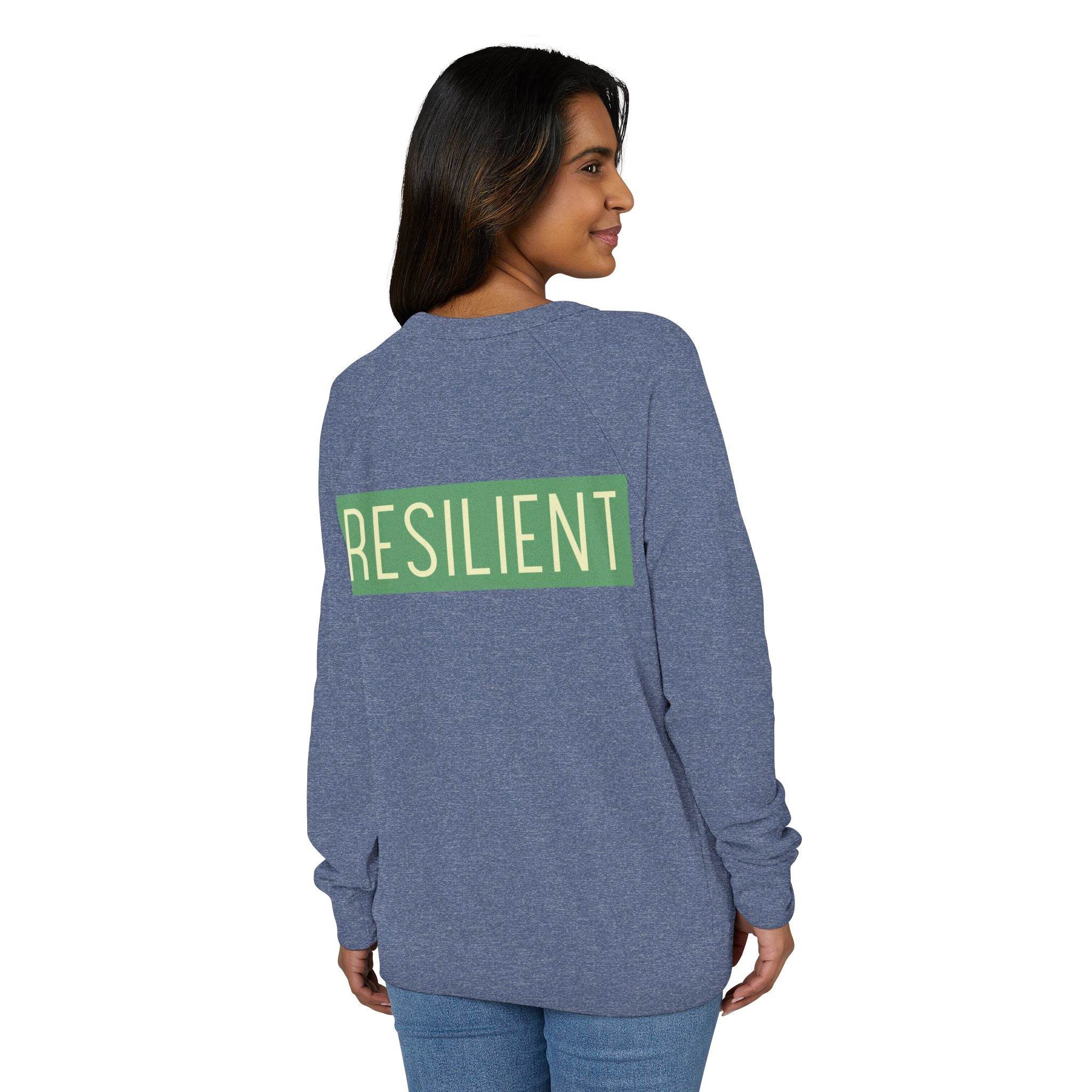 Woman wearing a blue Printify eco-friendly crewneck sweatshirt with resilient text on the back