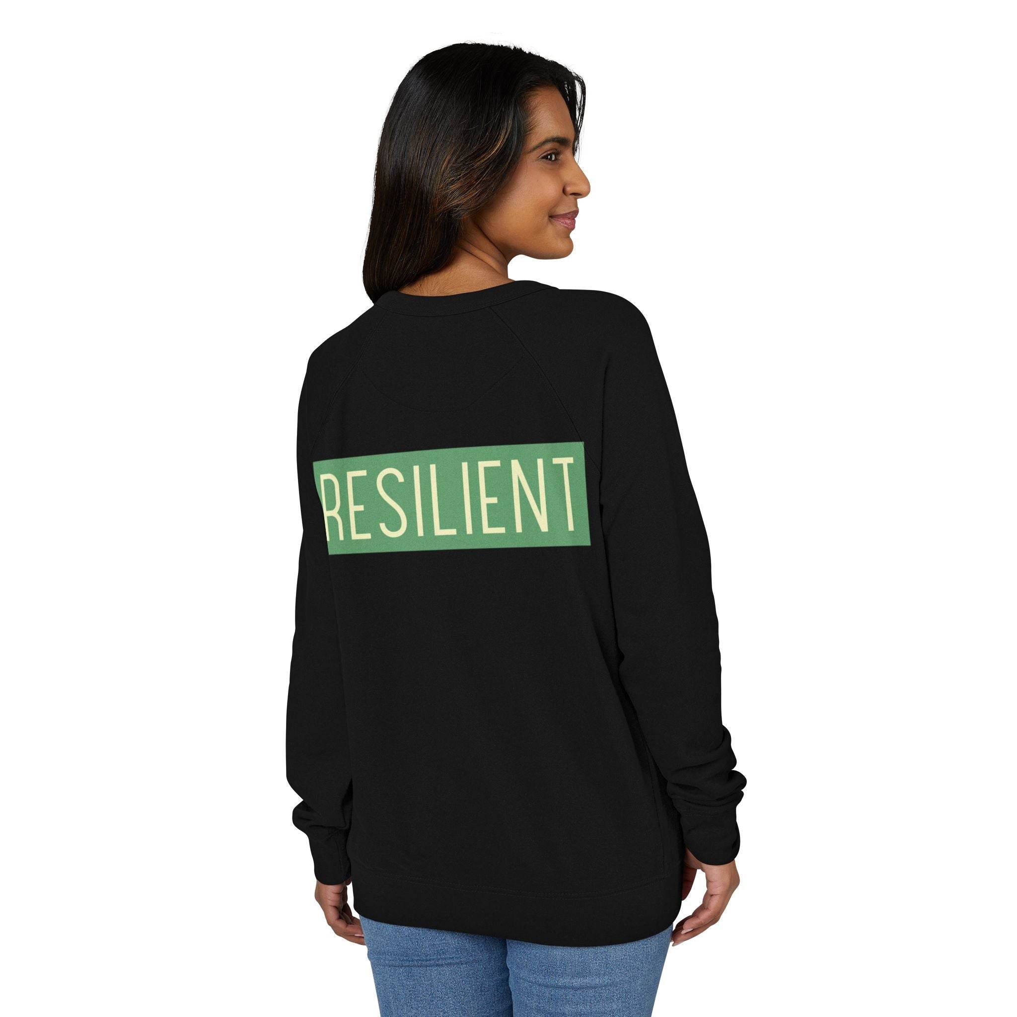 Printify eco-friendly crewneck sweatshirt in black with green RESILIENT text on back worn by woman