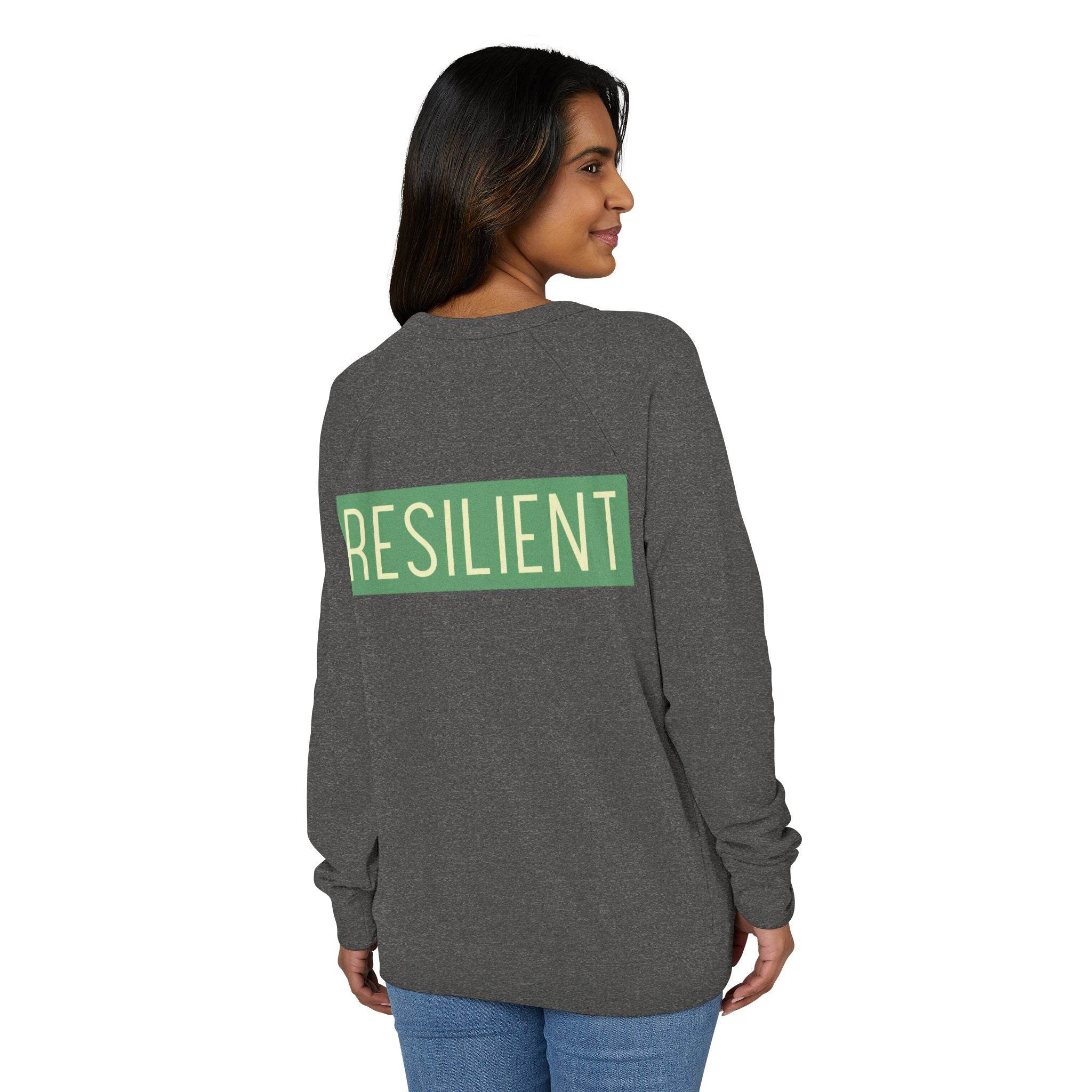 Woman wearing Printify eco-friendly crewneck sweatshirt in dark gray with resilient text on the back
