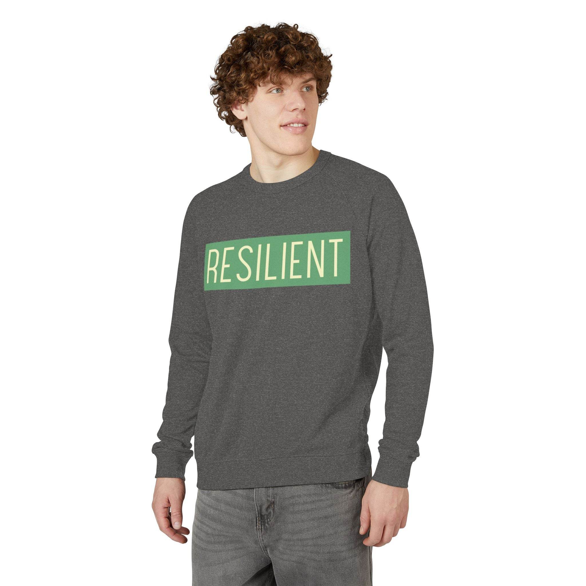 Printify eco-friendly crewneck sweatshirt in dark gray with resilient text worn by a man