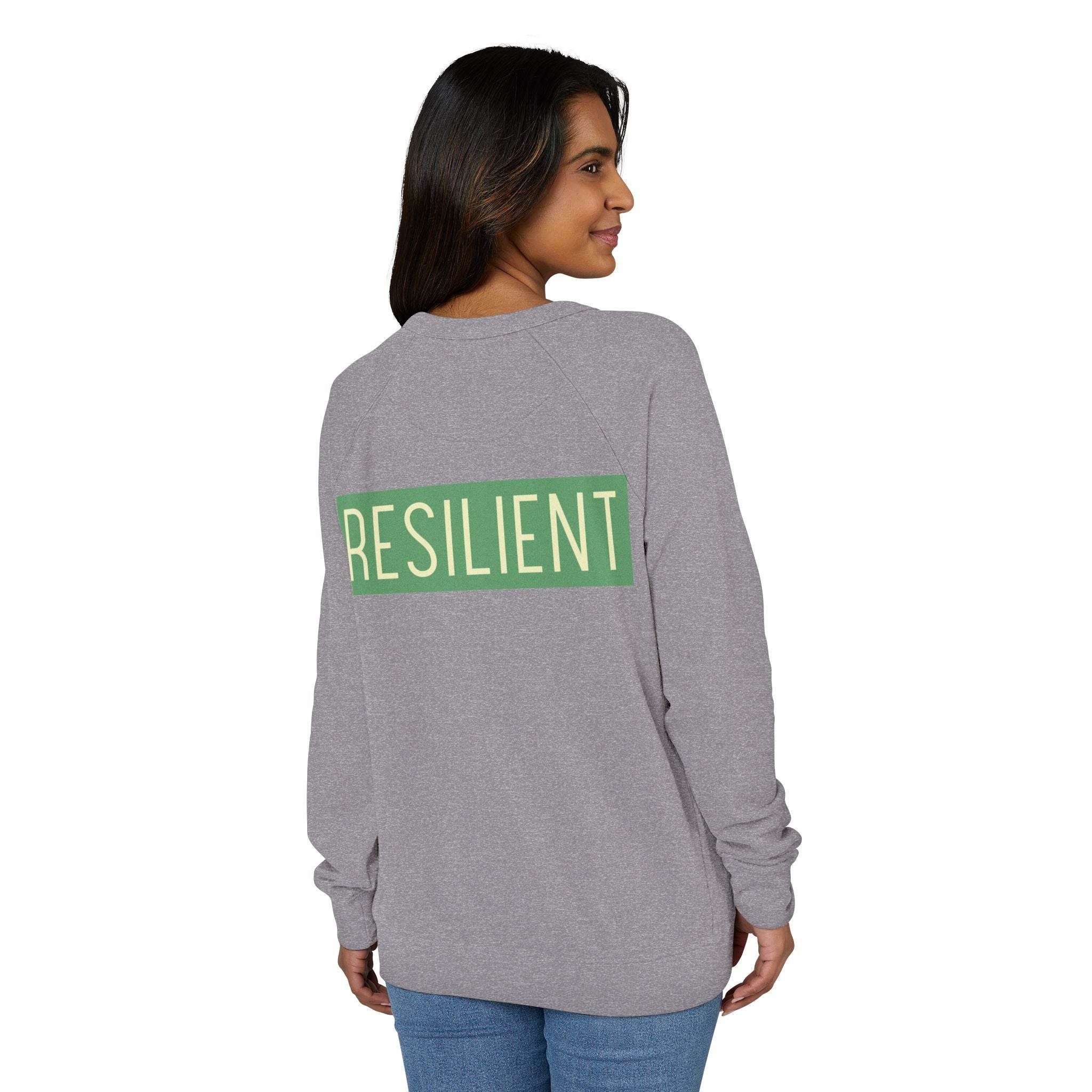 Woman wearing Printify eco-friendly crewneck sweatshirt in gray with resilient graphic on back