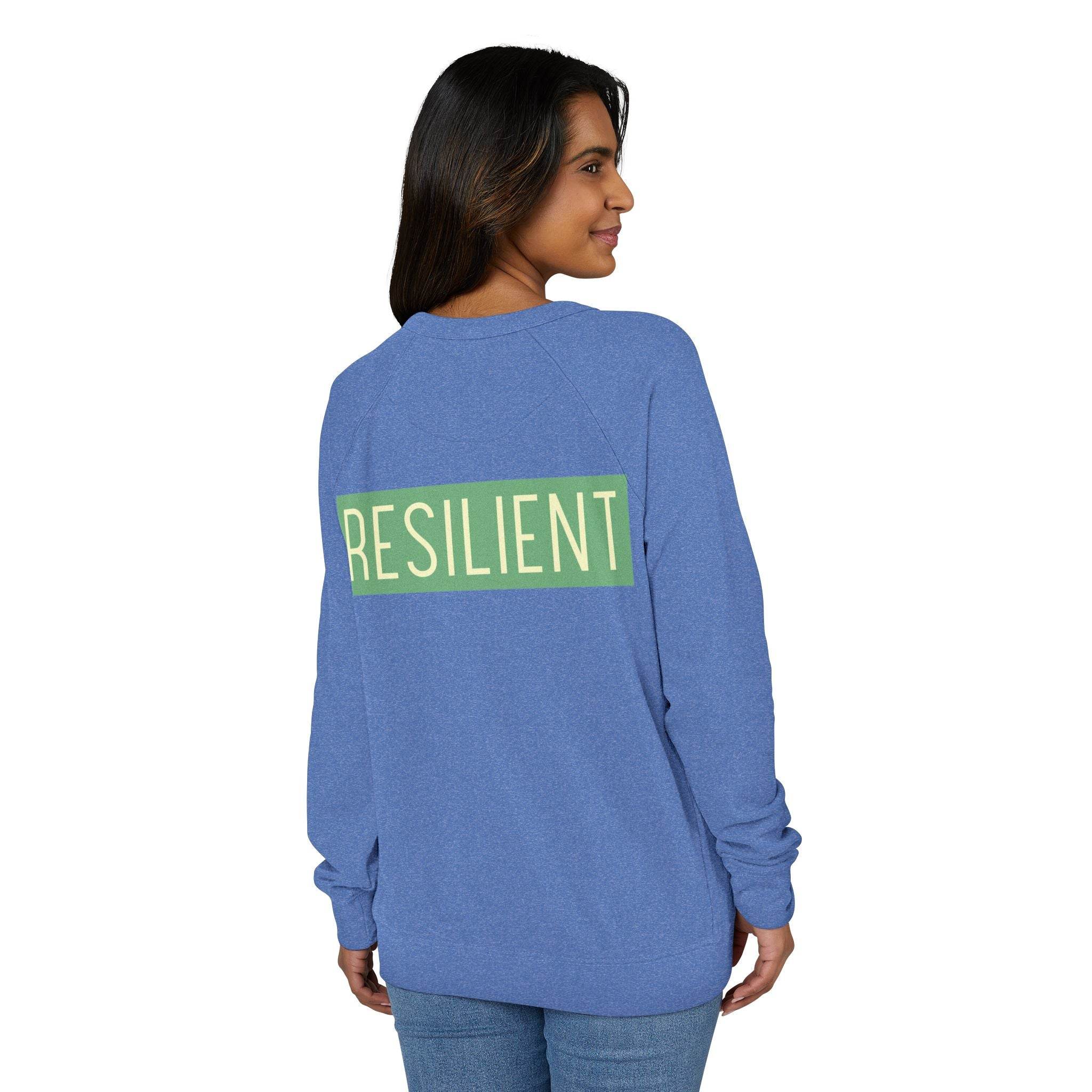 Printify eco-friendly crewneck sweatshirt in blue with resilient text design on the back worn by woman