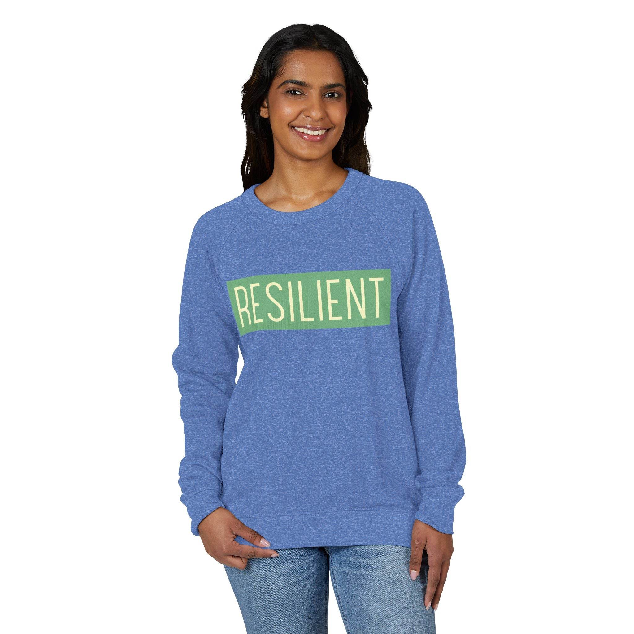 Printify eco-friendly crewneck sweatshirt in blue with resilient text design worn by smiling woman