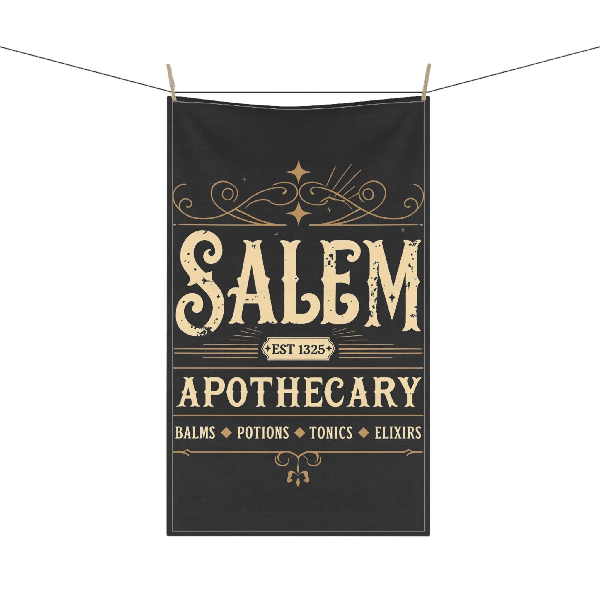 Printify eco-friendly kitchen towel with vintage Salem Apothecary black design hanging on clothesline