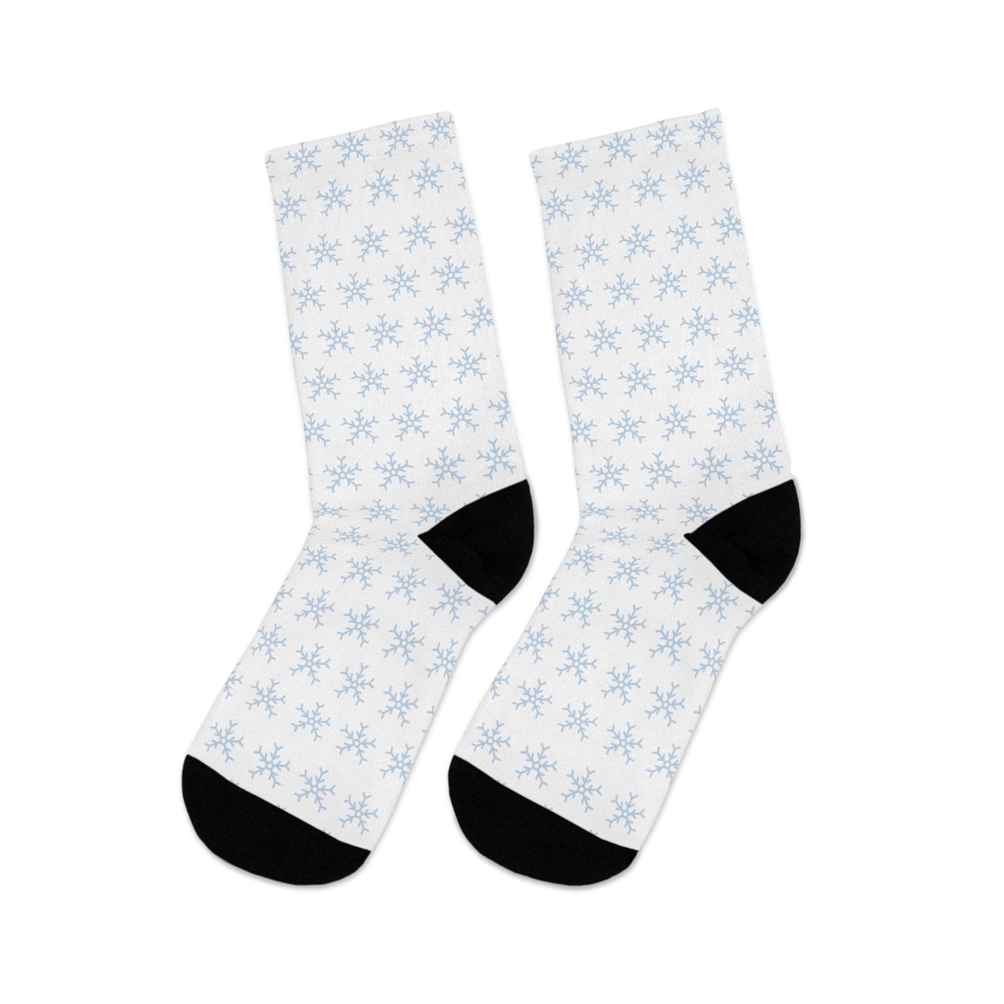 White socks with light blue snowflake pattern and black heels and toes sustainable recycled poly socks