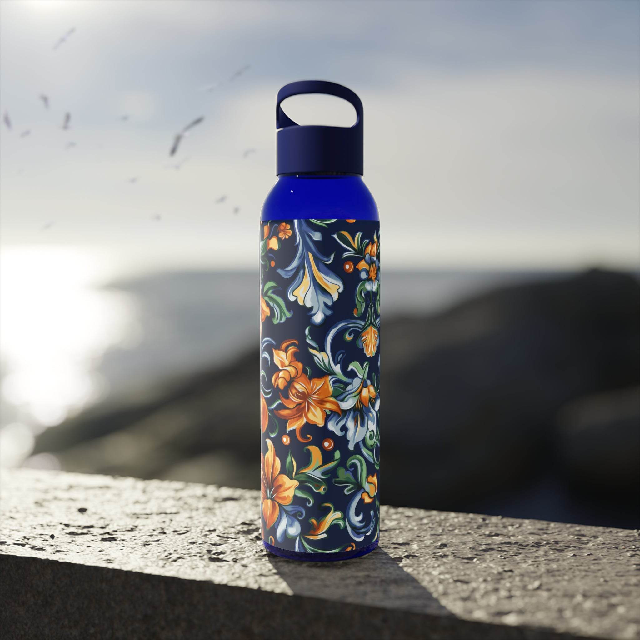 Printify stylish eco water bottle with blue cap and colorful floral design outdoors
