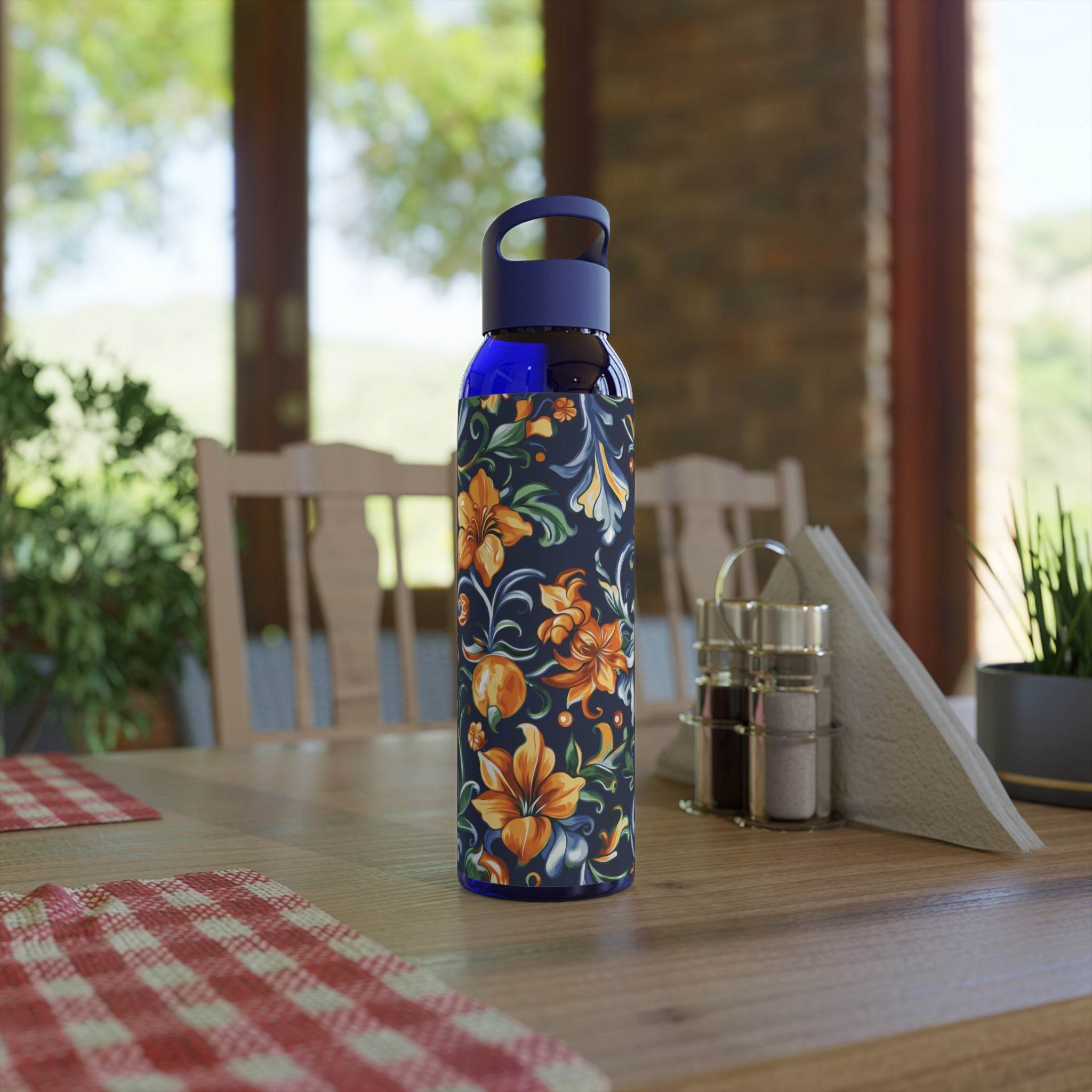 Printify stylish eco water bottle with blue lid and floral design on wooden kitchen table