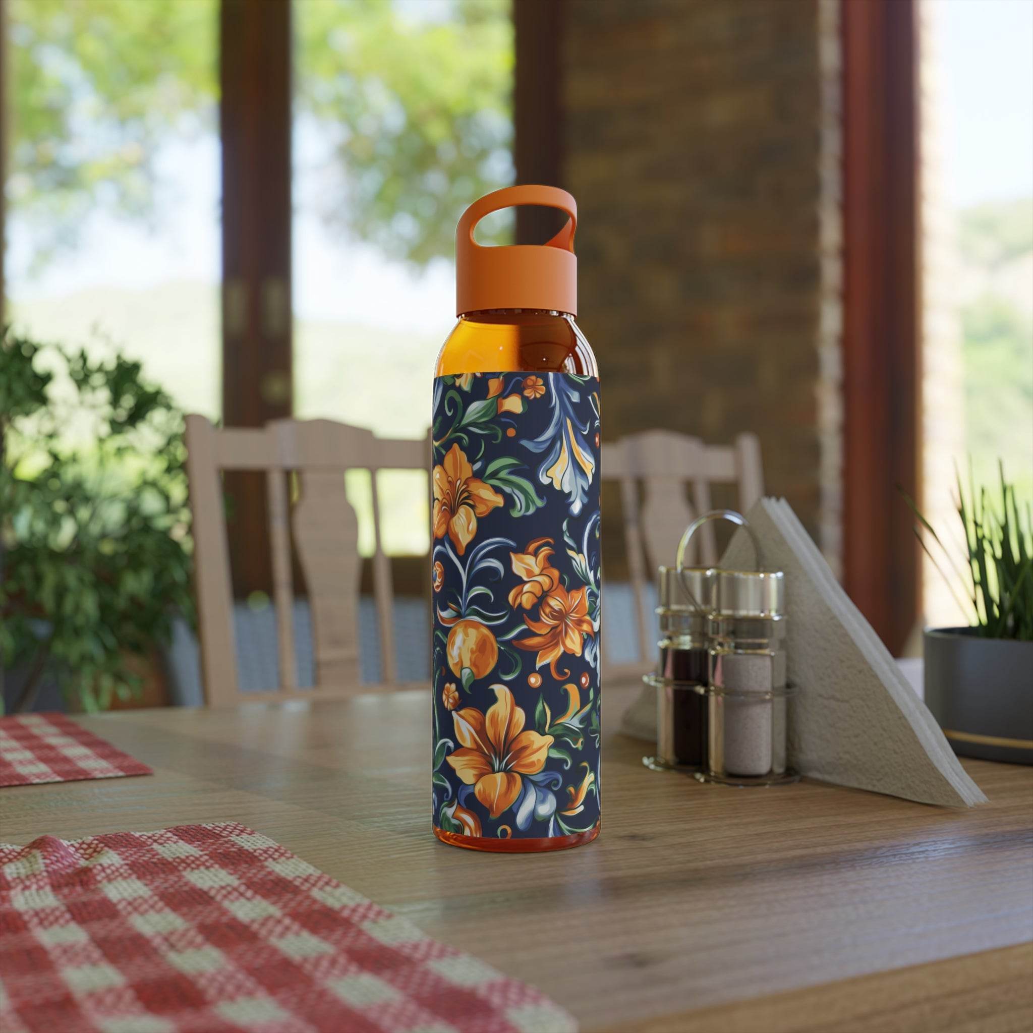 Printify stylish eco water bottle with orange floral design and orange cap on wooden table