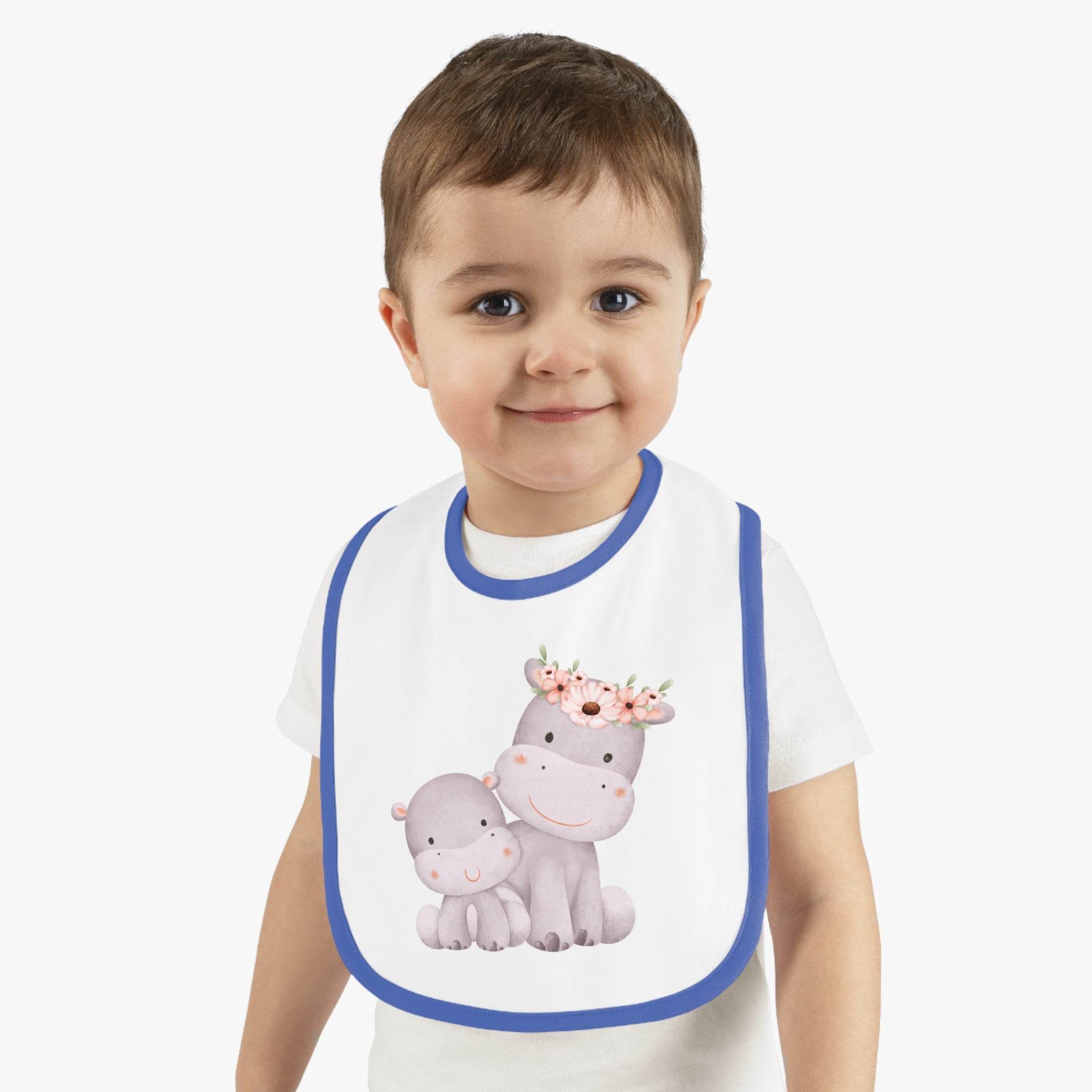 Toddler wearing a Printify sustainable baby jersey bib with a cute hippo and flower crown design
