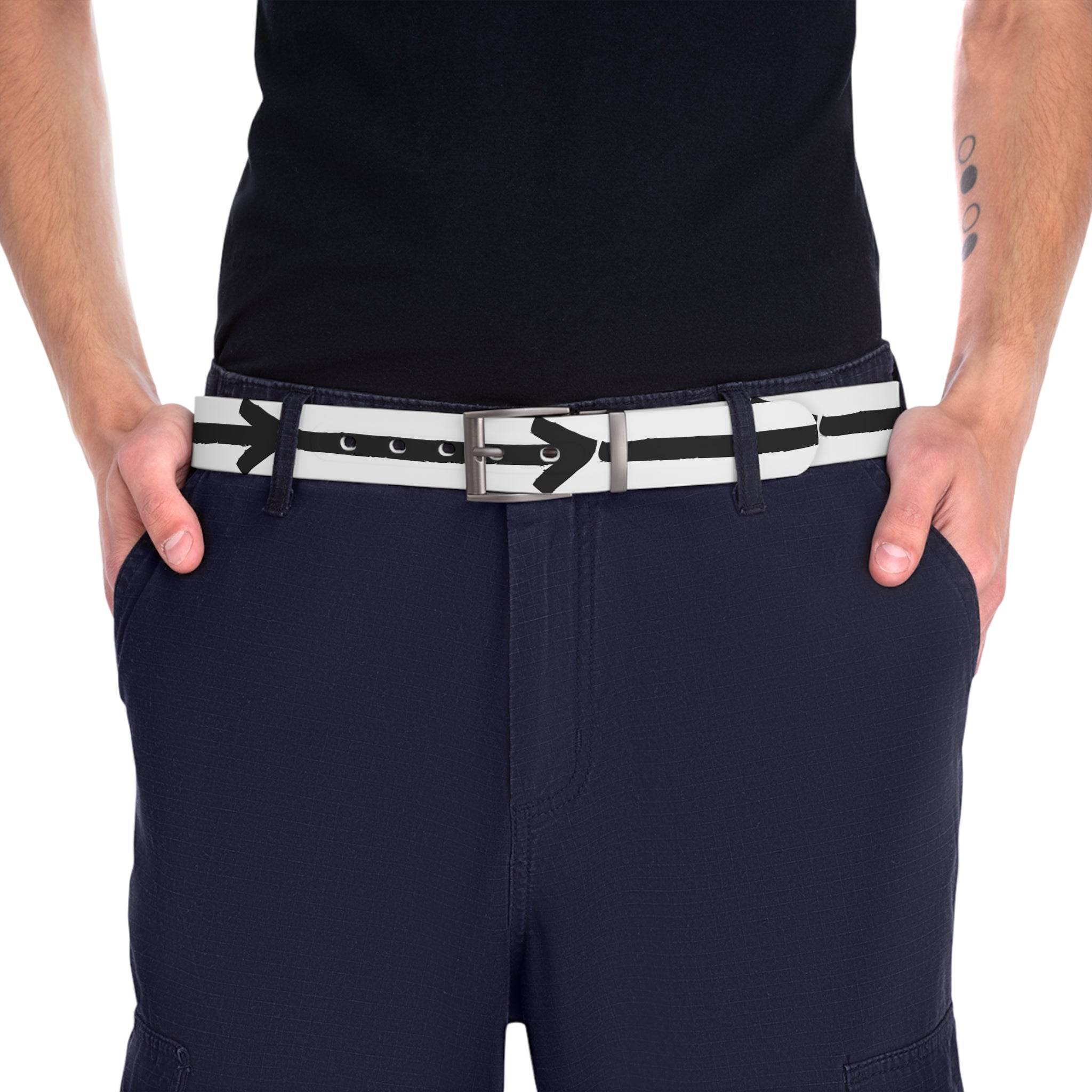 Person wearing a sustainable direction belt with black arrow design and silver buckle on navy pants