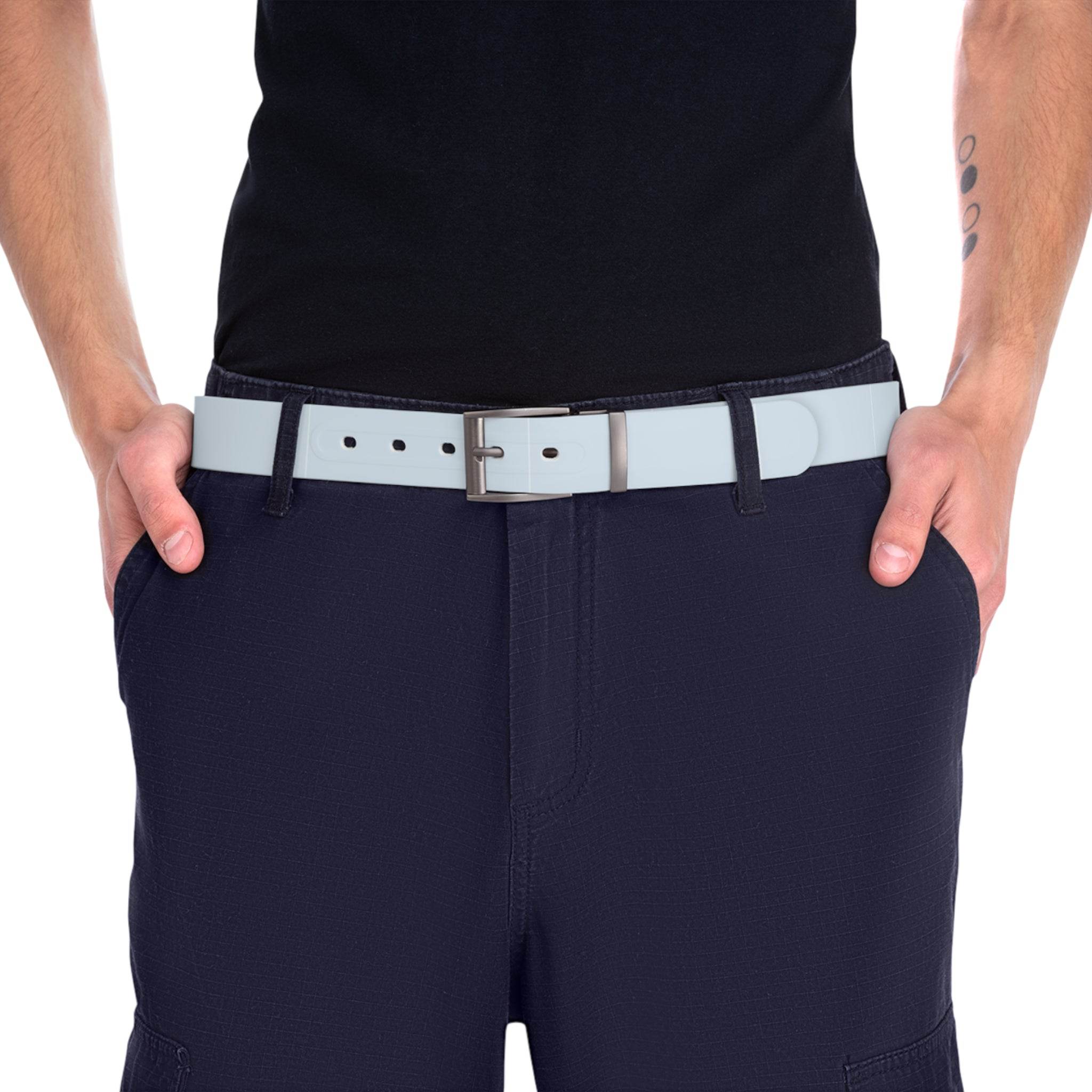 Man wearing a white sustainable fashion belt with silver buckle paired with black pants and black shirt