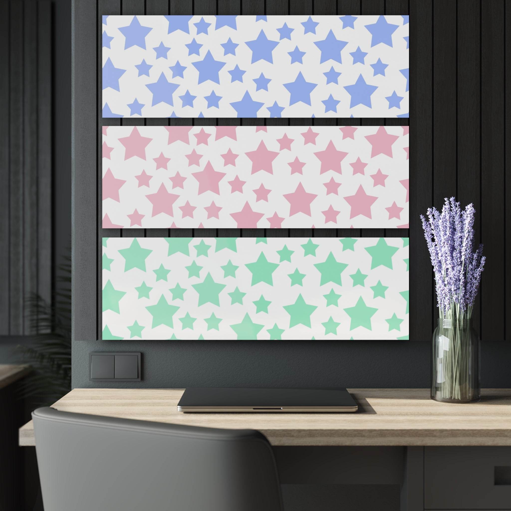 Printify sustainable triptych prints featuring blue, pink, and green star patterns displayed above a workspace with laptop