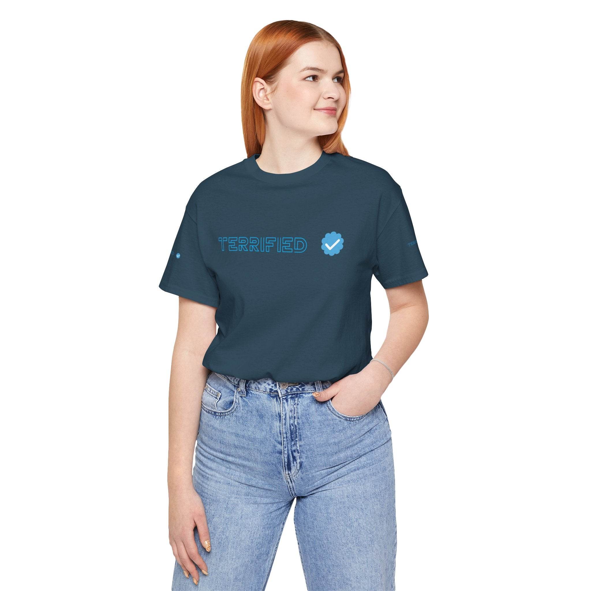 Printify navy blue terrifed graphic t-shirt worn by woman with red hair and light blue jeans