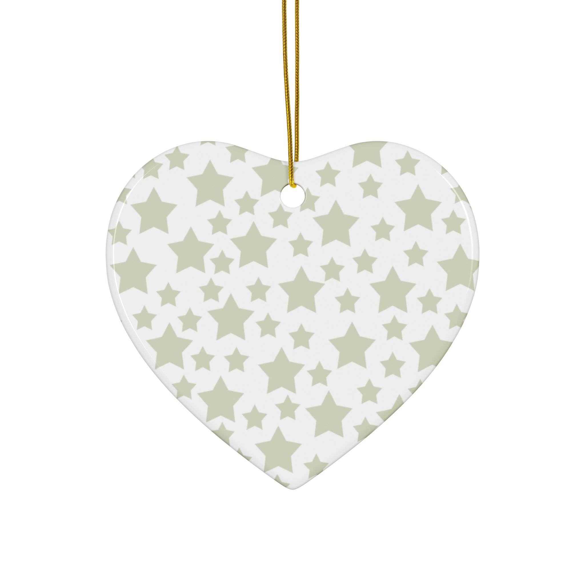 Heart-shaped seasonal decoration with gray twinkling stars holiday decoration pattern hanging by gold string