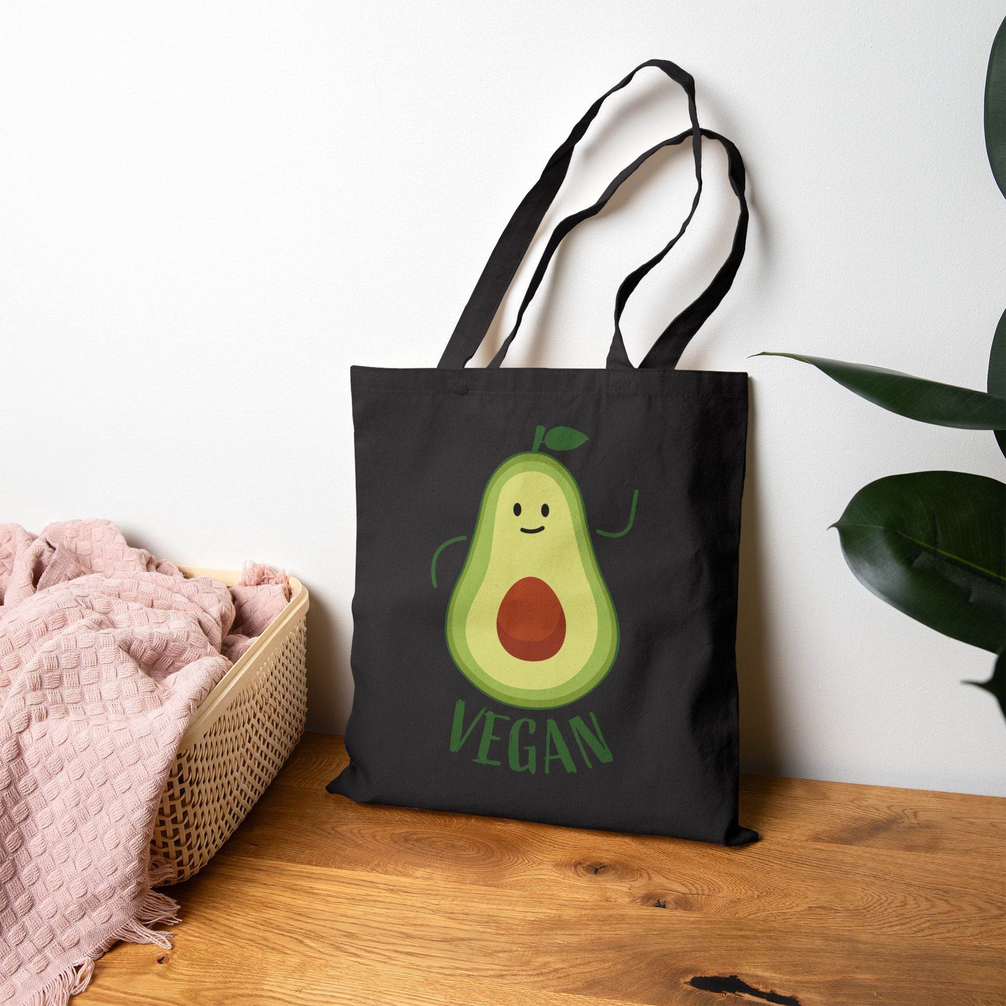 Printify black eco-friendly cotton tote bag with smiling avocado graphic and vegan text