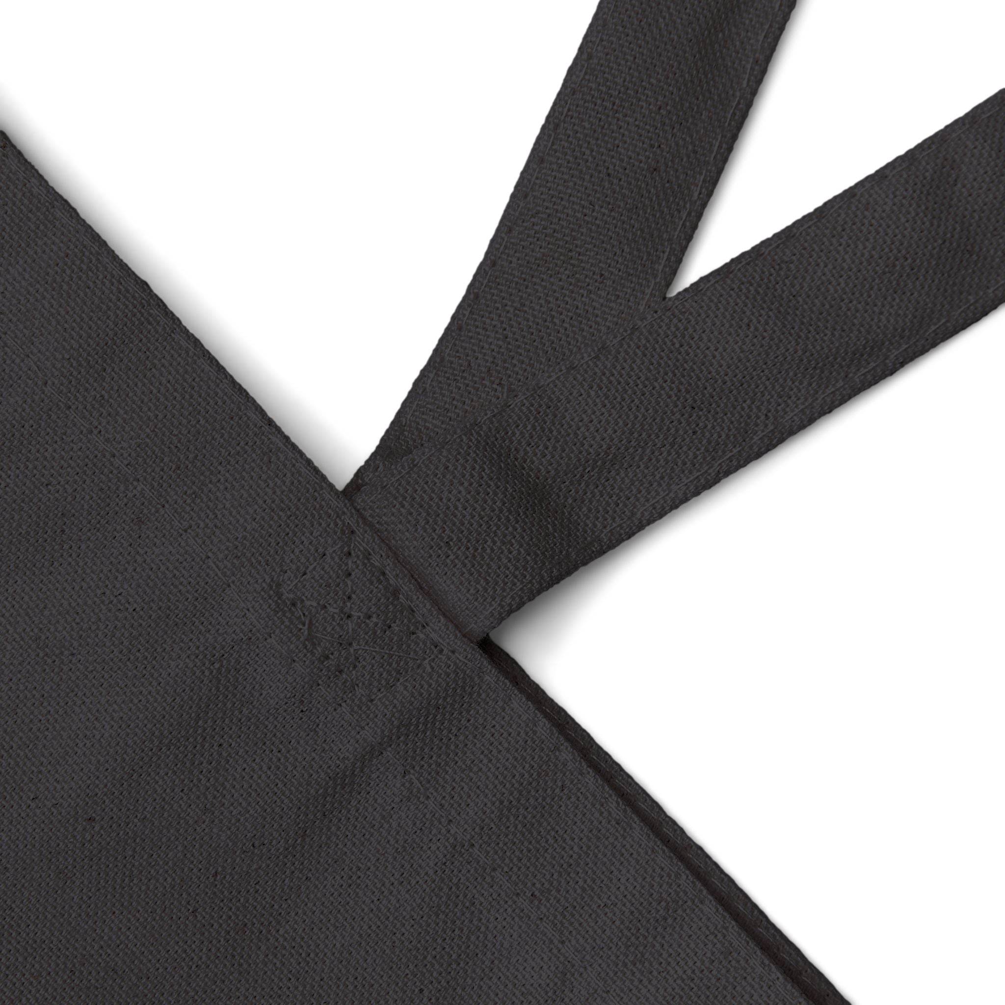 Close-up of black eco-friendly cotton tote bag strap showing durable stitching