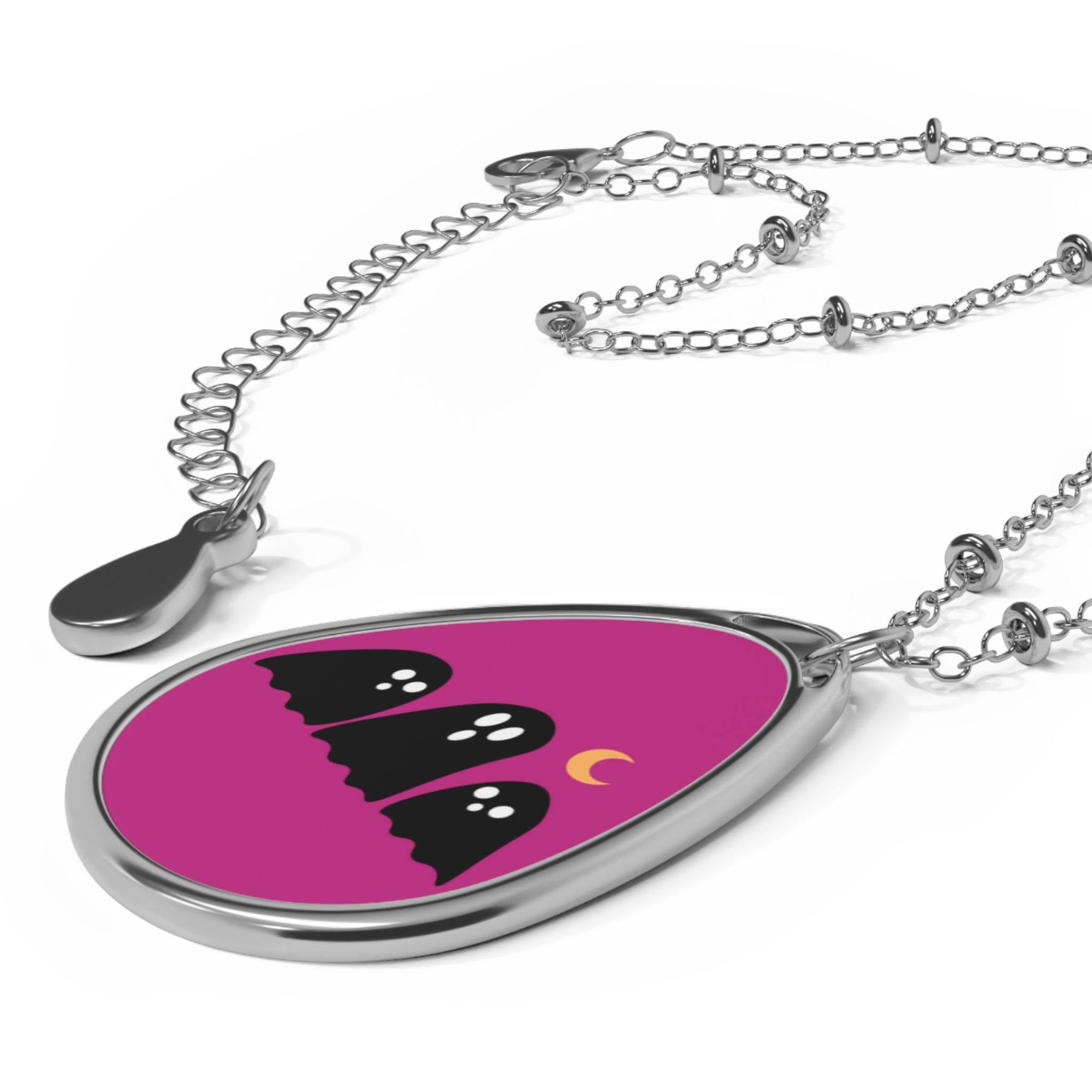 Printify eco-friendly ghost necklace with silver chain and three black ghost figures on purple background